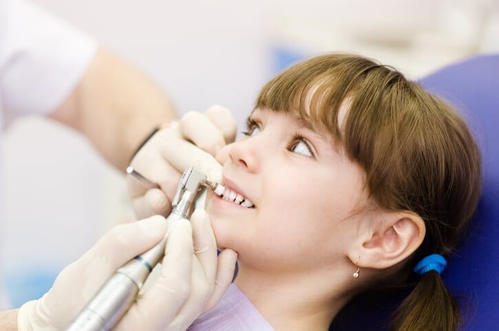 Medical dentist procedure of teeth polishing — Oral & Maxillofacial Pathology & Surgery Dentists in Tucson, AZ