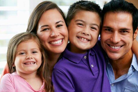 Family at home together — Oral & Maxillofacial Pathology & Surgery Dentists
