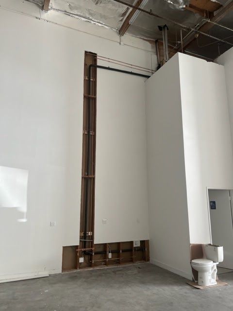 An empty room with a toilet in it