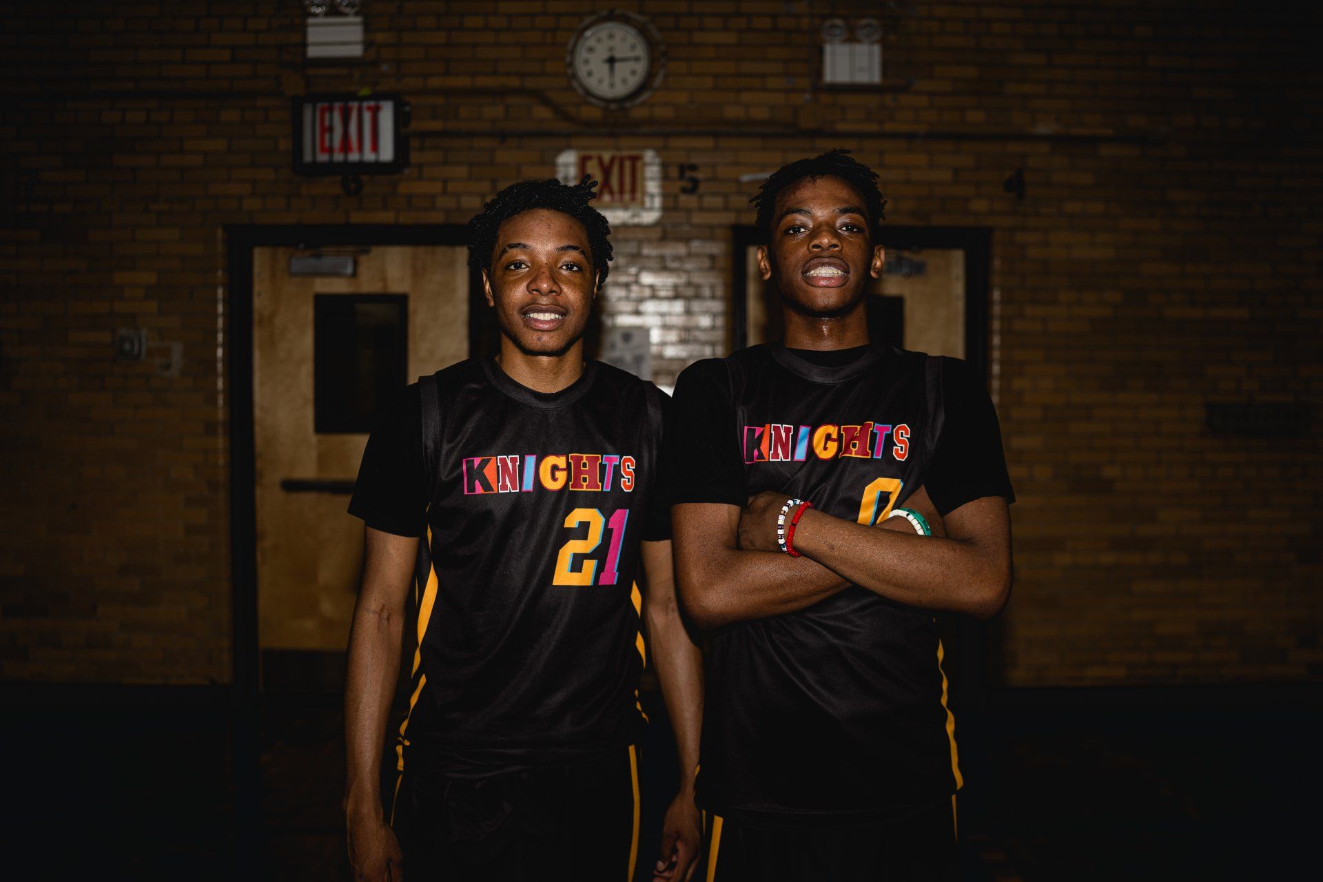 Members of the New Design High School basketball team, The Knights, pose together