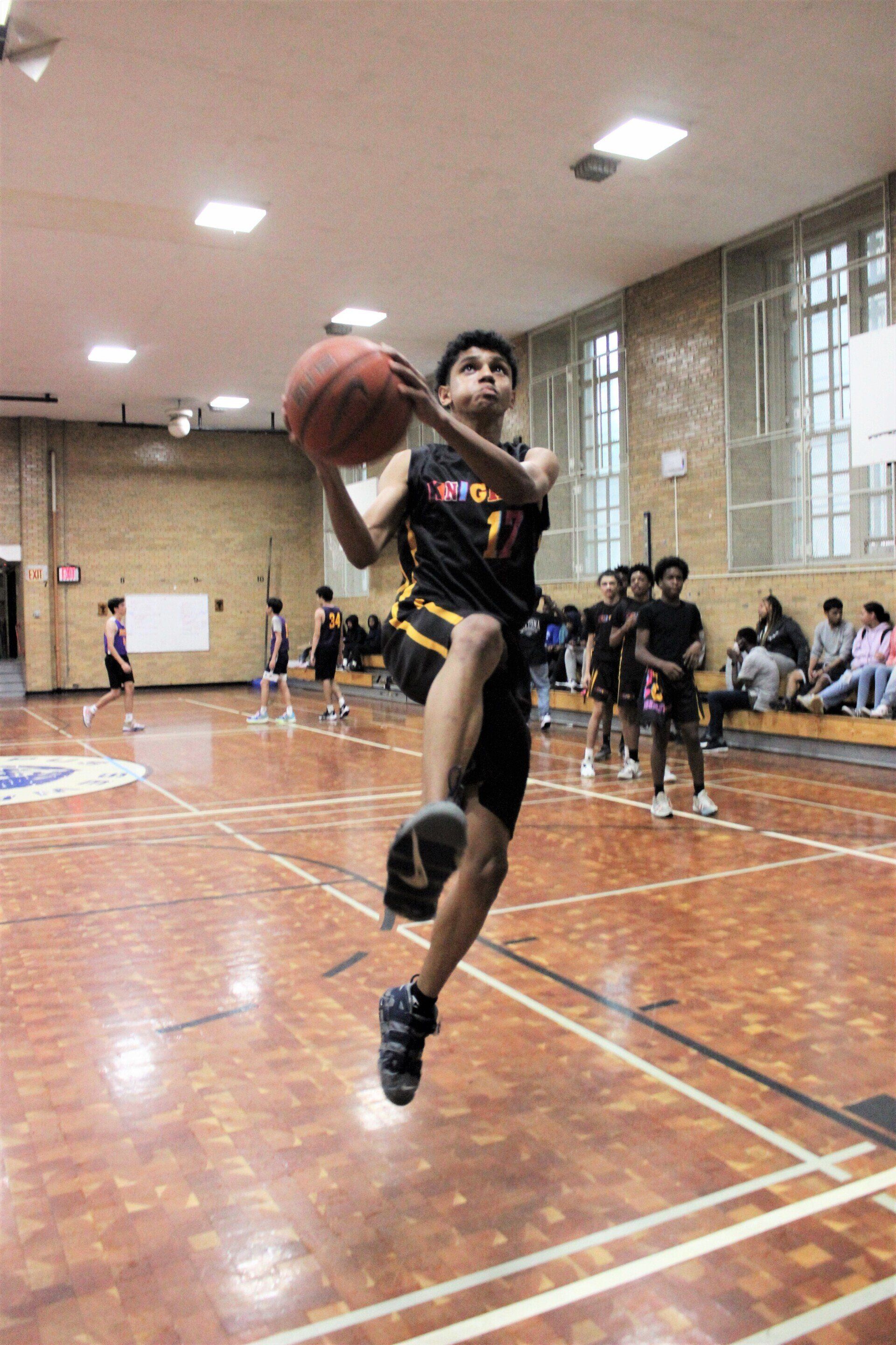 Student drives a layup