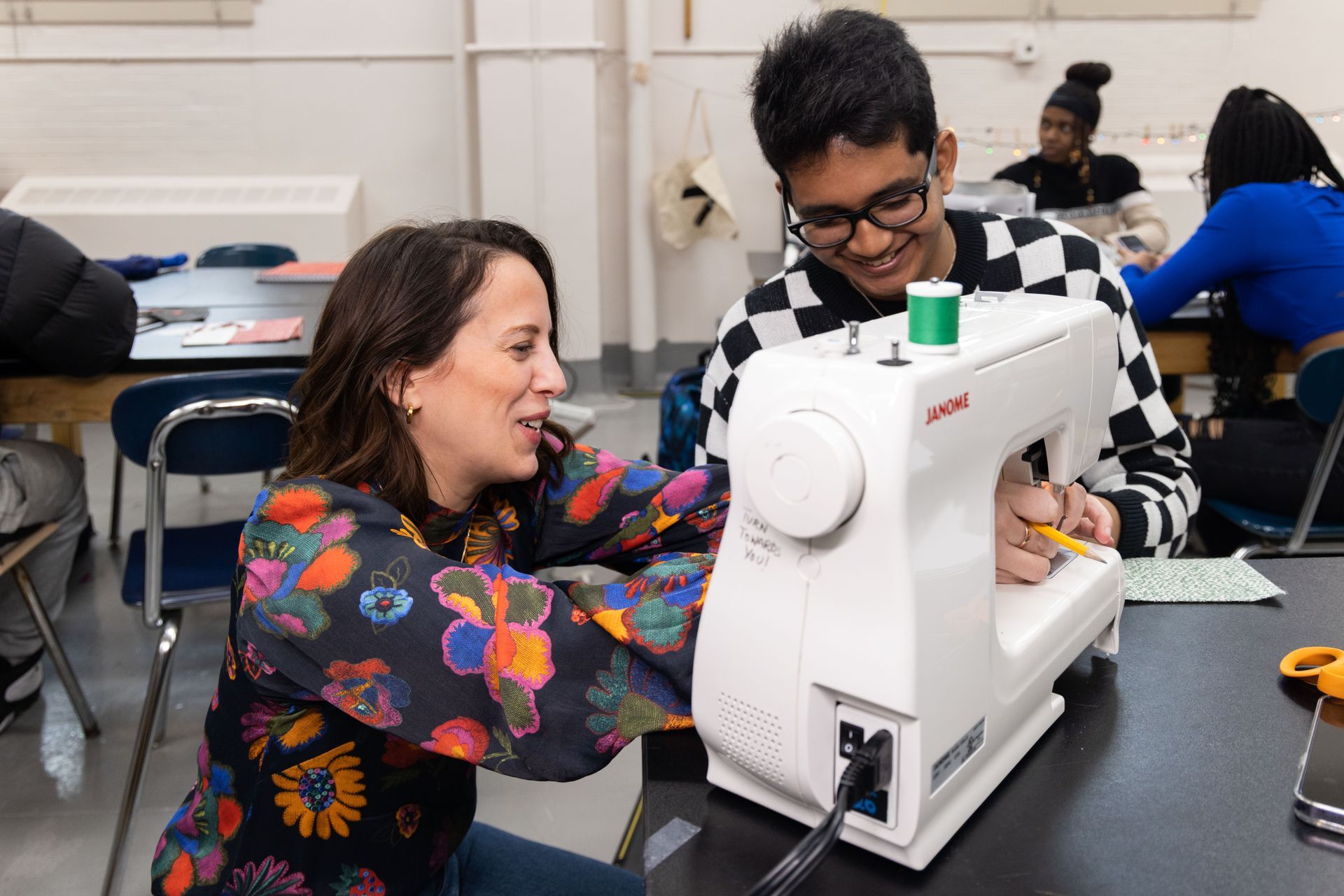 A teacher helping a student
