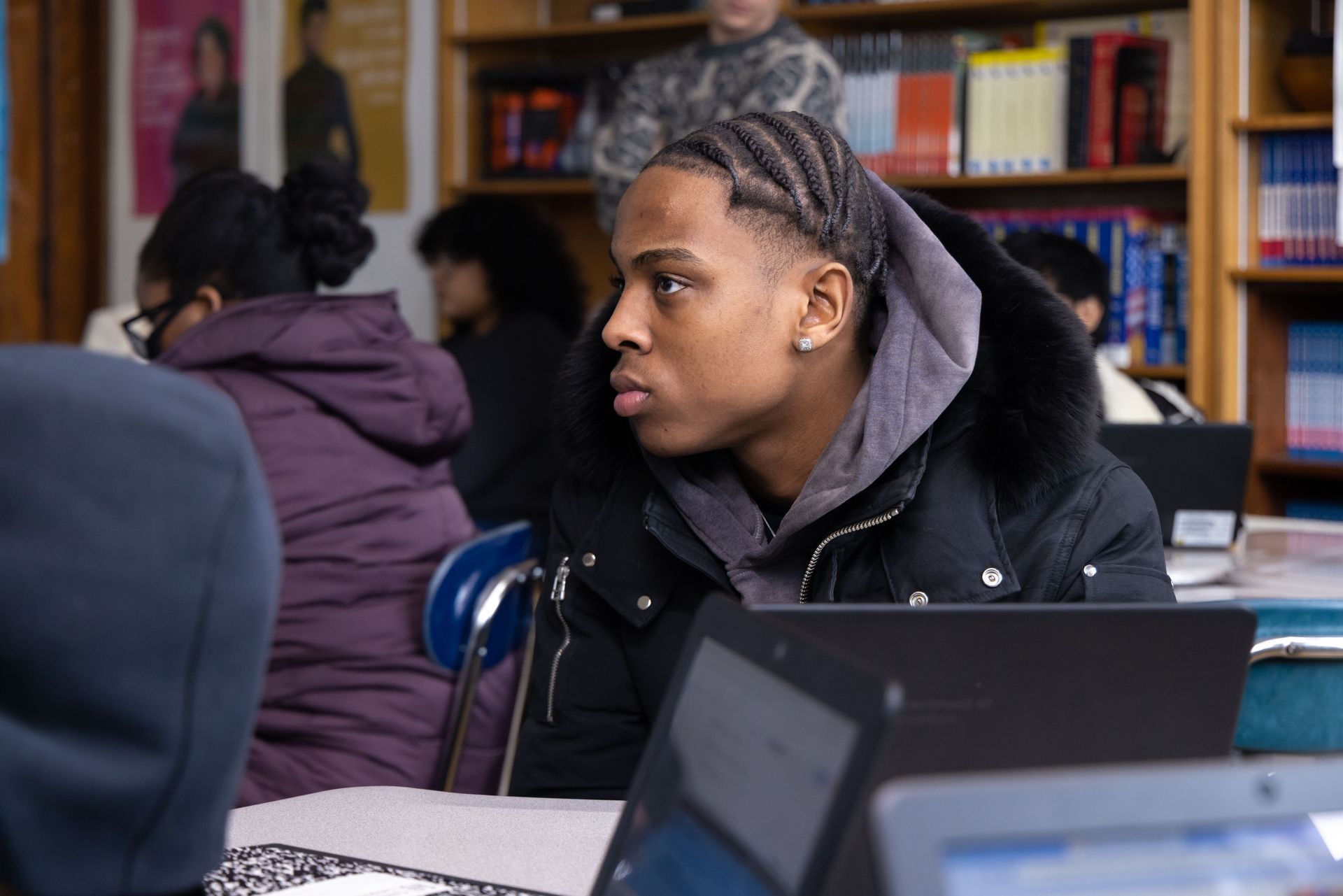 A student listening to teacher in class