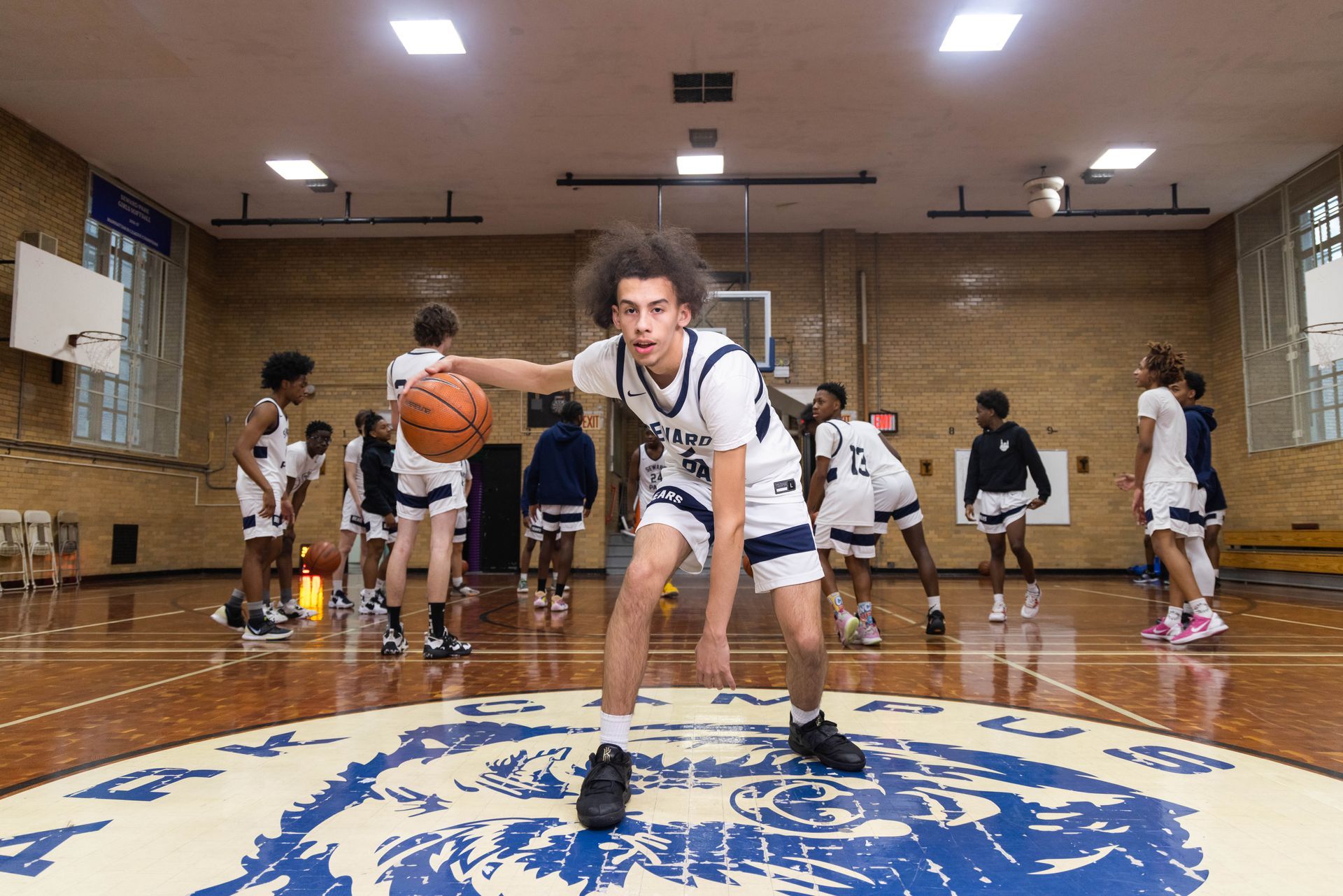 Student basketball player dribbling