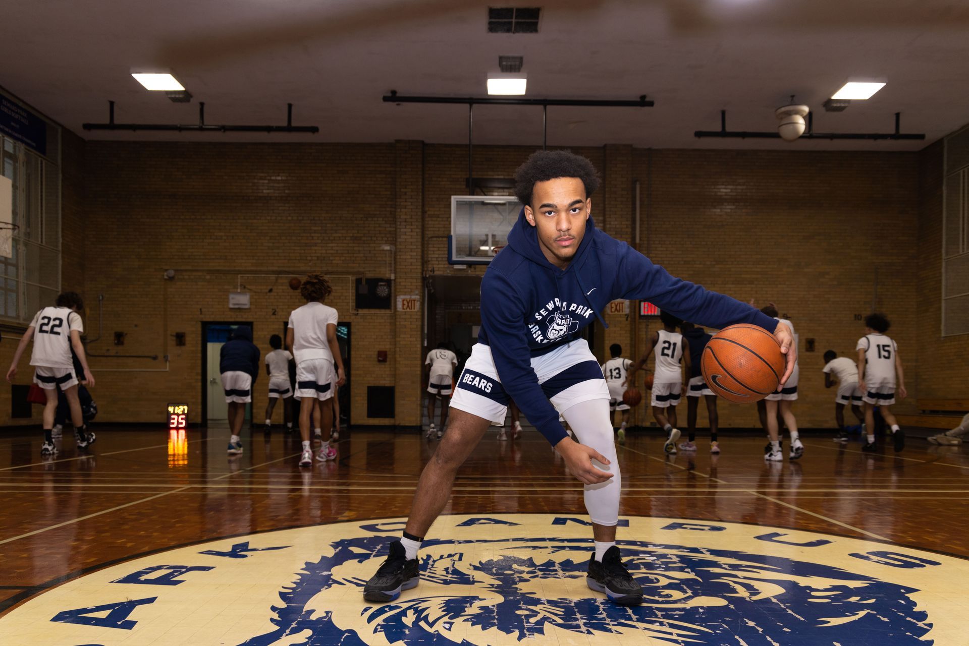 Student basketball player dribbling