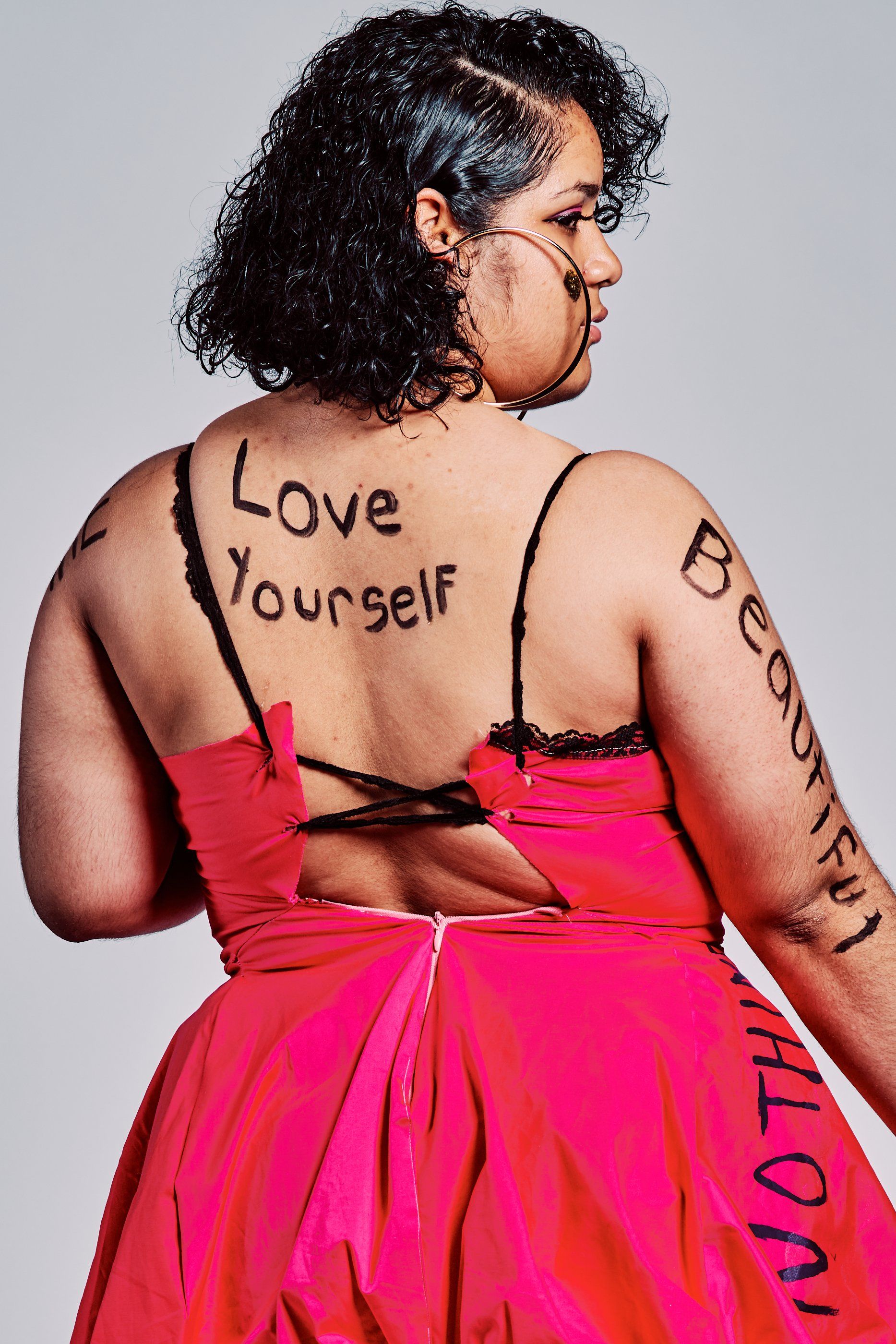 Model in hand-made garment at the 2019 Sustainable Fashion Show at New Design High School