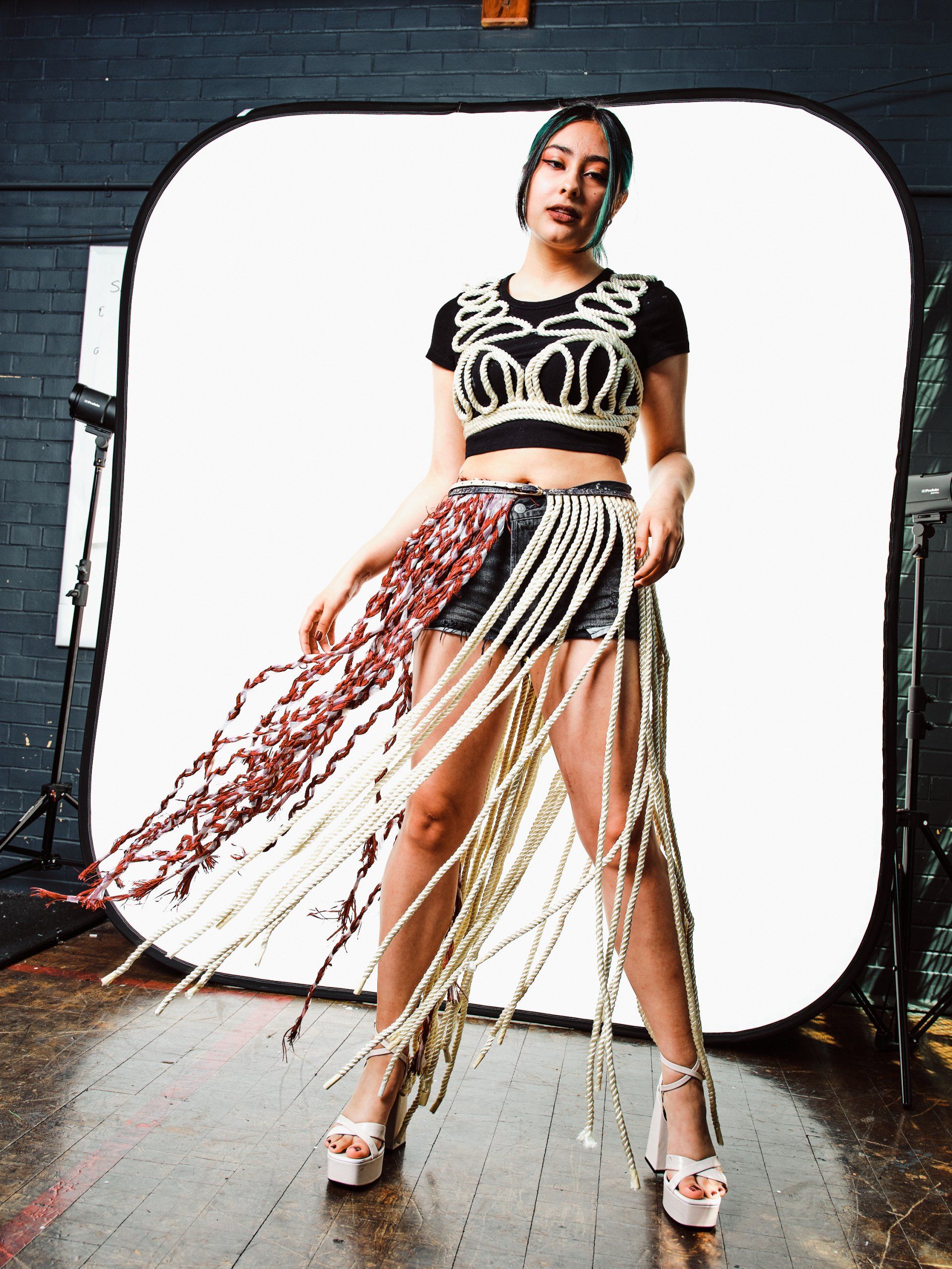 Model in hand-made garment at the 2022 Sustainable Fashion Show at New Design High School. Photo by Christian Rodriguez