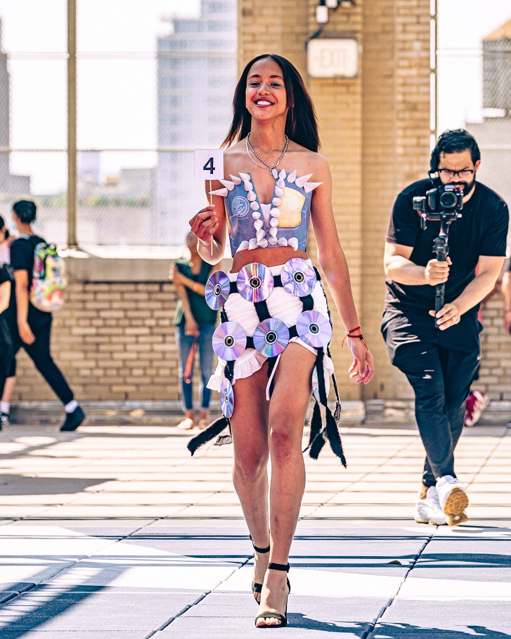 Model in hand-made garment at the 2023 Sustainable Fashion Show at New Design High School. Photo by Luis Suarez