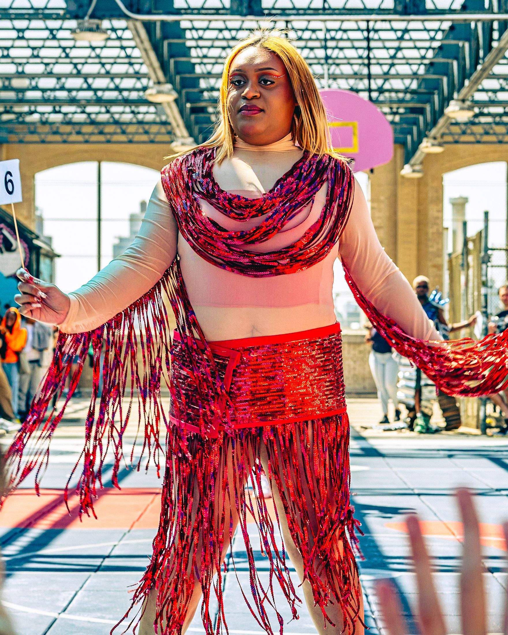 Model in hand-made garment at the 2023 Sustainable Fashion Show at New Design High School. Photo by Luis Suarez