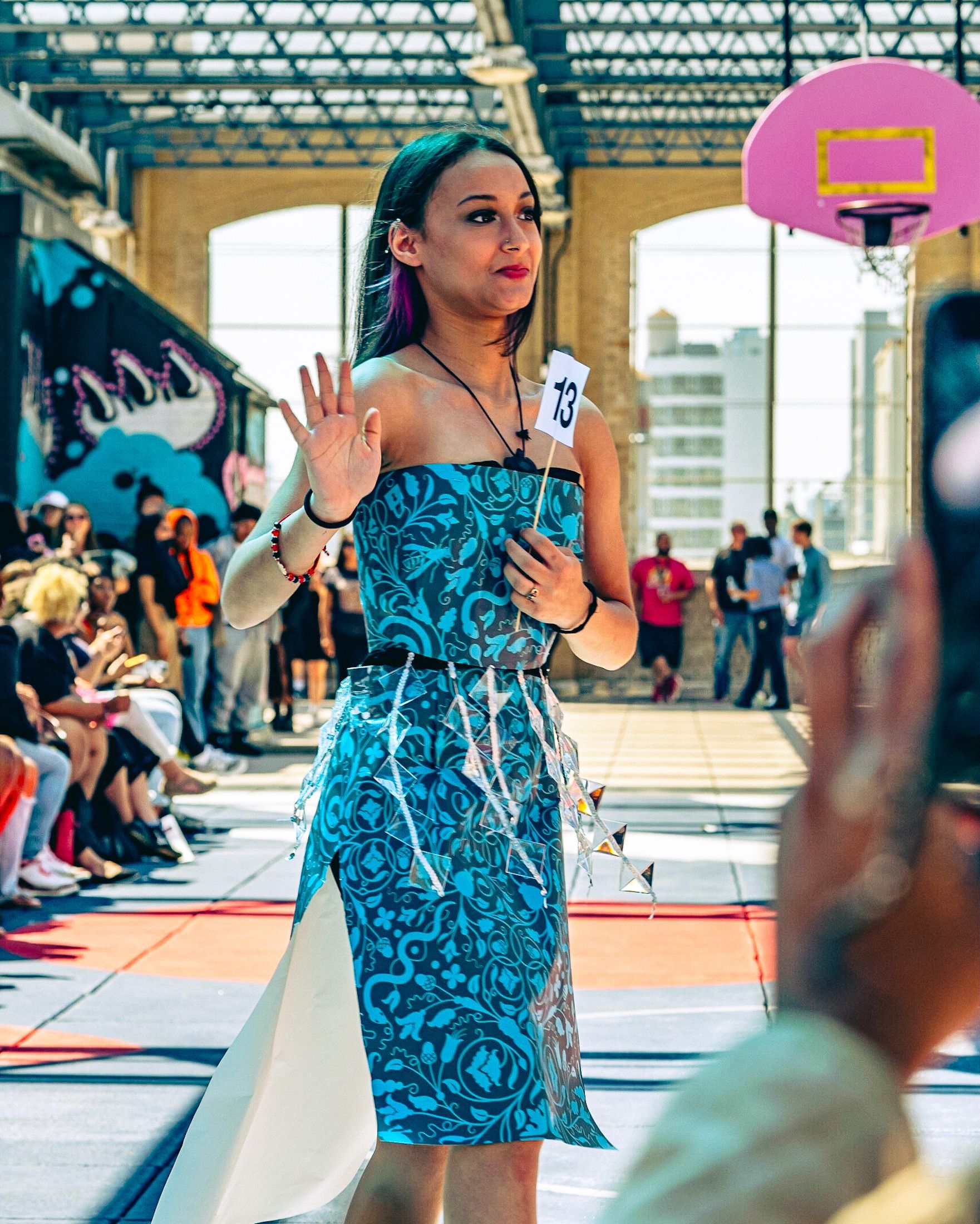 Model in hand-made garment at the 2023 Sustainable Fashion Show at New Design High School. Photo by Luis Suarez