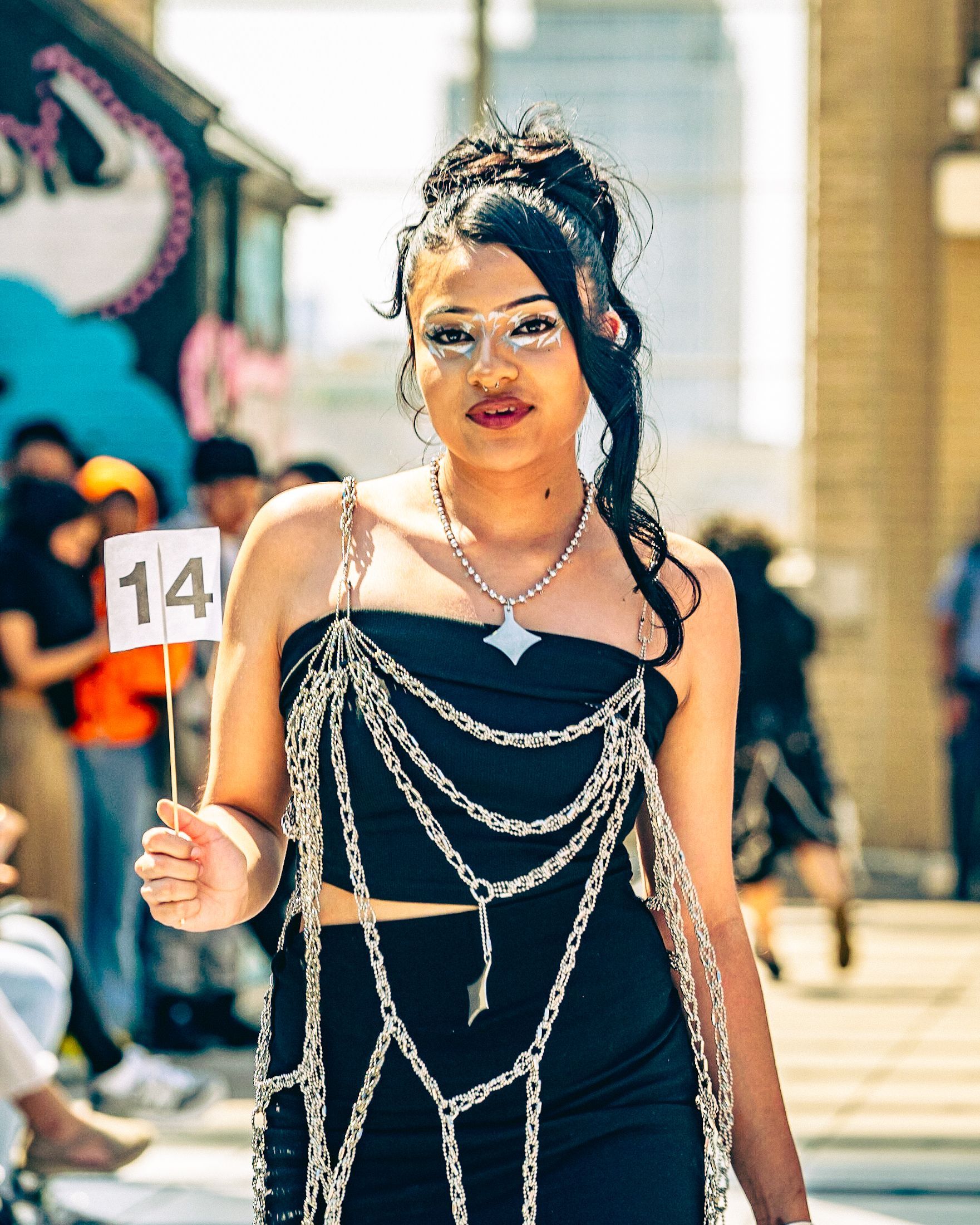 Model in hand-made garment at the 2023 Sustainable Fashion Show at New Design High School. Photo by Luis Suarez