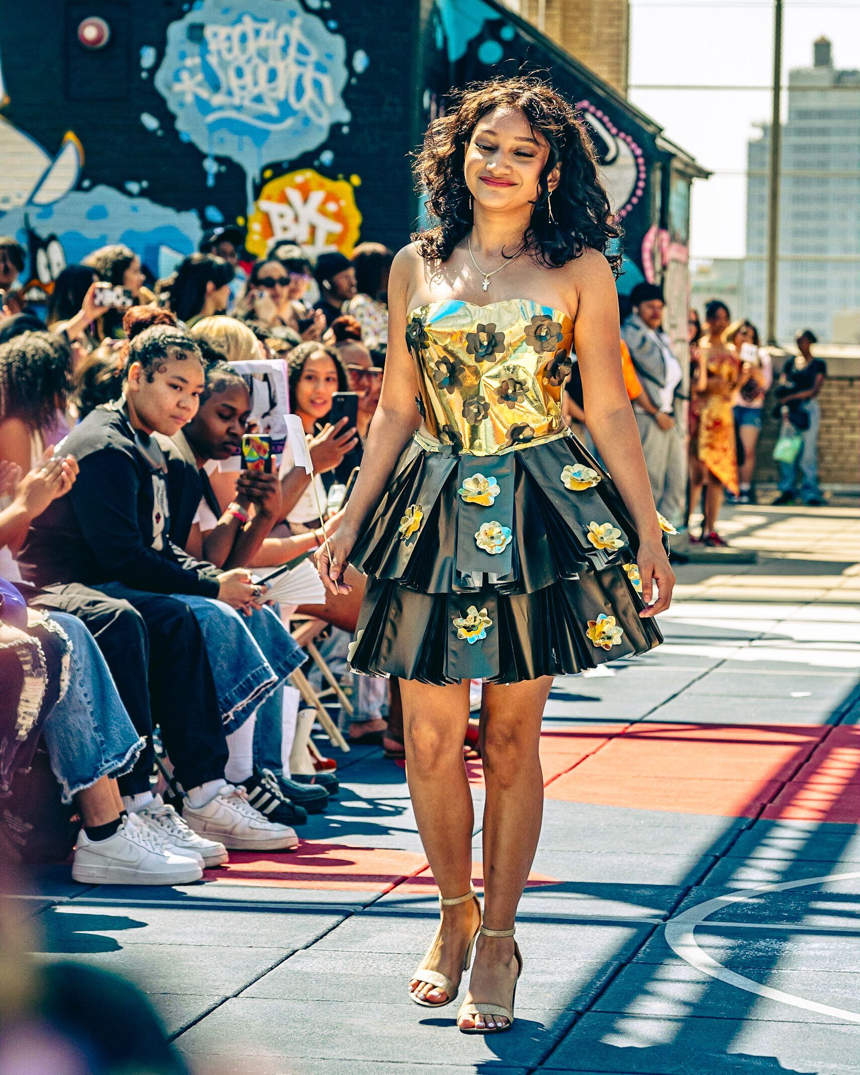 Model in hand-made garment at the 2023 Sustainable Fashion Show at New Design High School. Photo by Luis Suarez