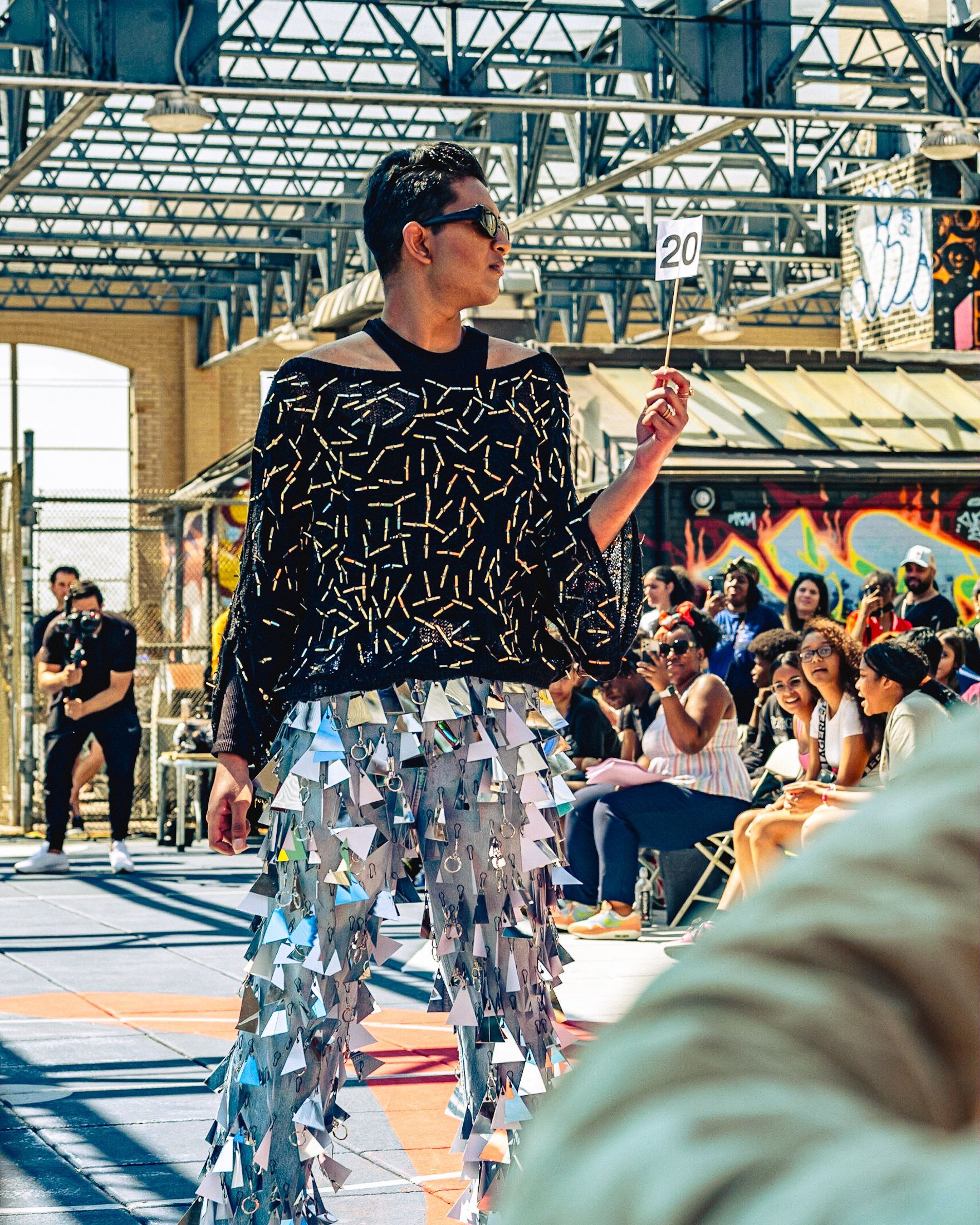 Model in hand-made garment at the 2023 Sustainable Fashion Show at New Design High School. Photo by Luis Suarez