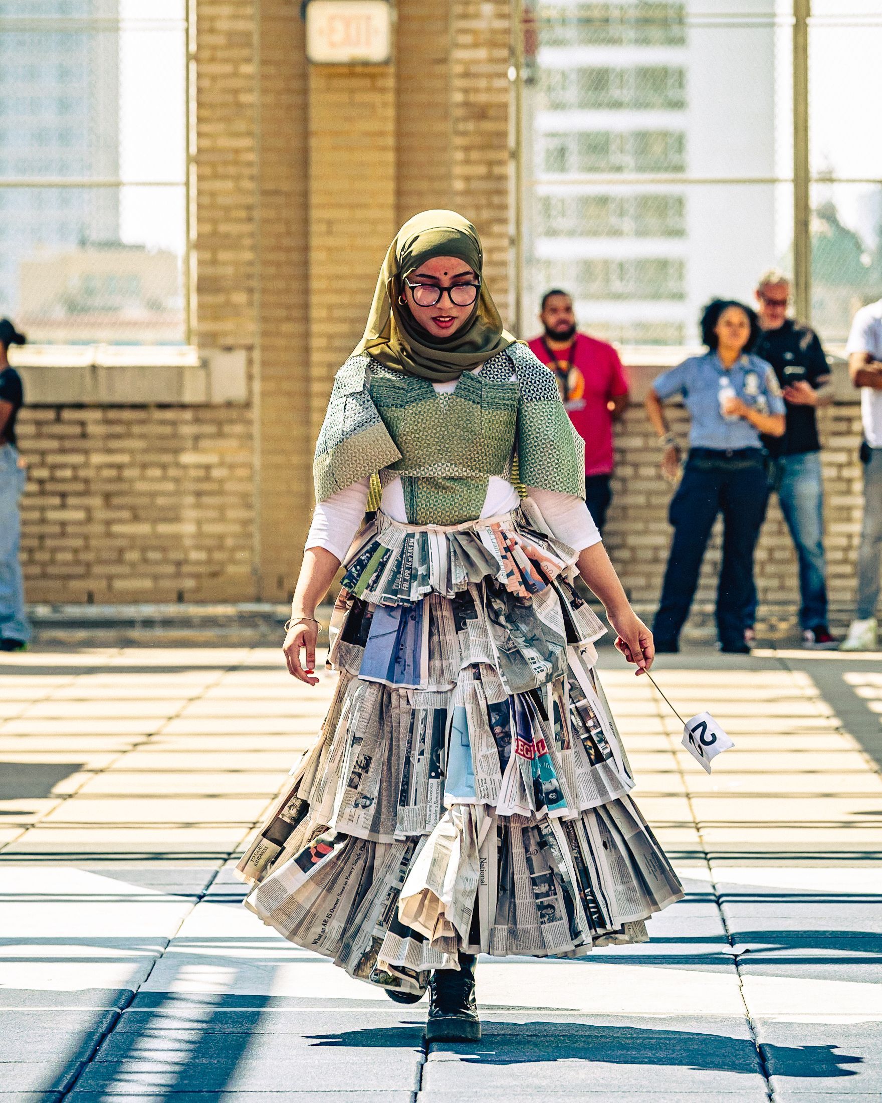 Model in hand-made garment at the 2023 Sustainable Fashion Show at New Design High School. Photo by Luis Suarez