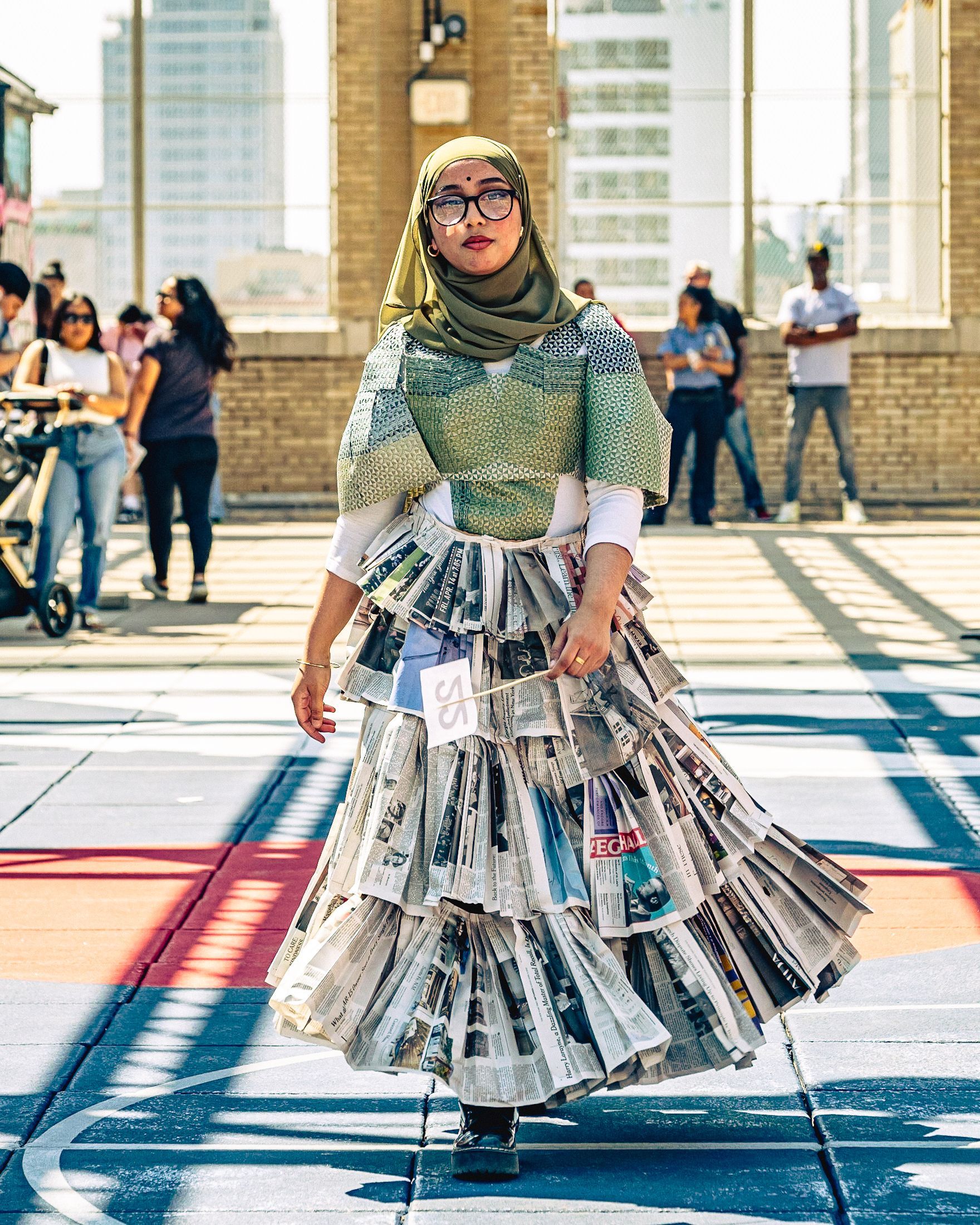 Model in hand-made garment at the 2023 Sustainable Fashion Show at New Design High School. Photo by Luis Suarez