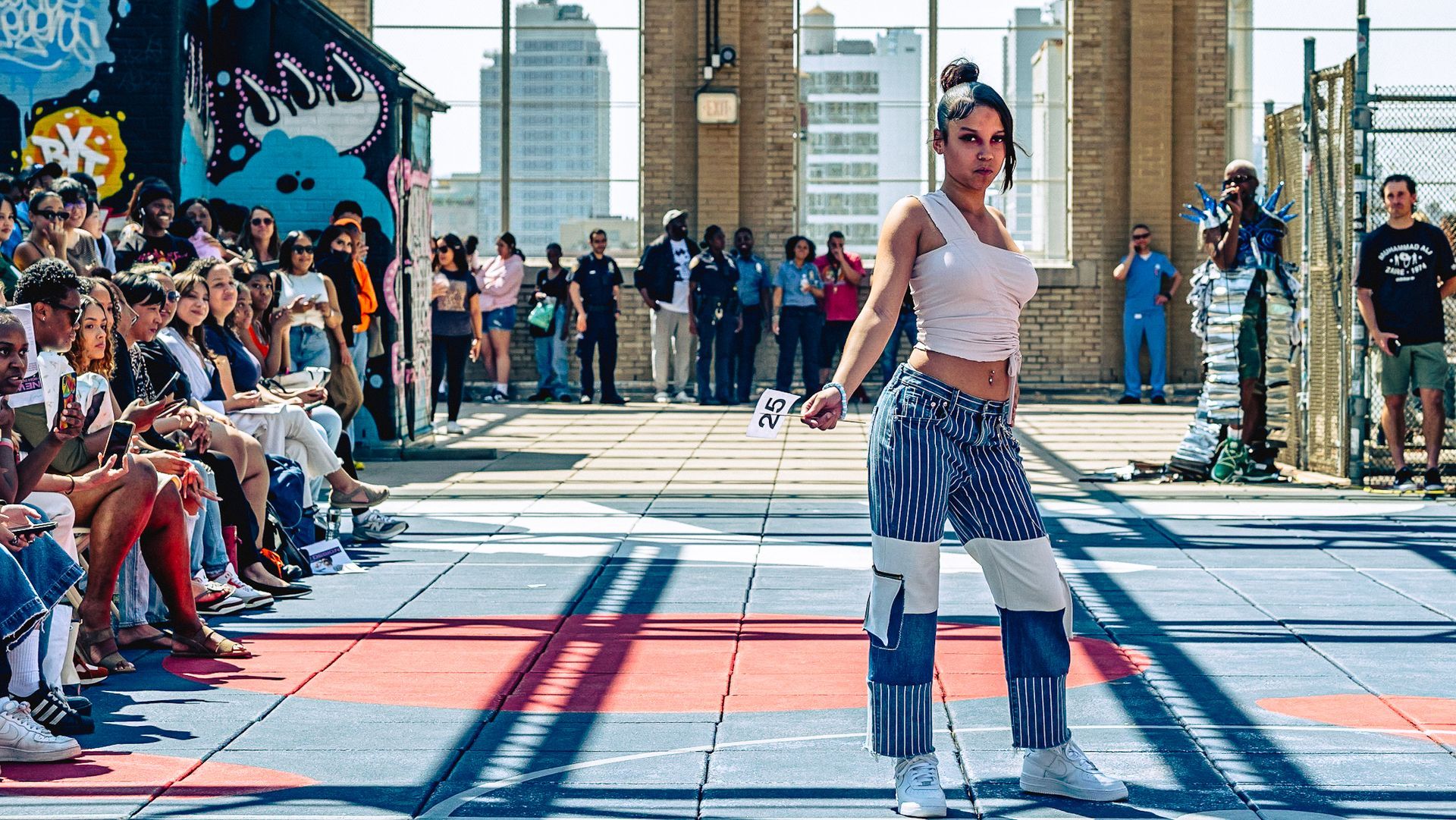 Model in hand-made garment at the 2023 Sustainable Fashion Show at New Design High School. Photo by Luis Suarez