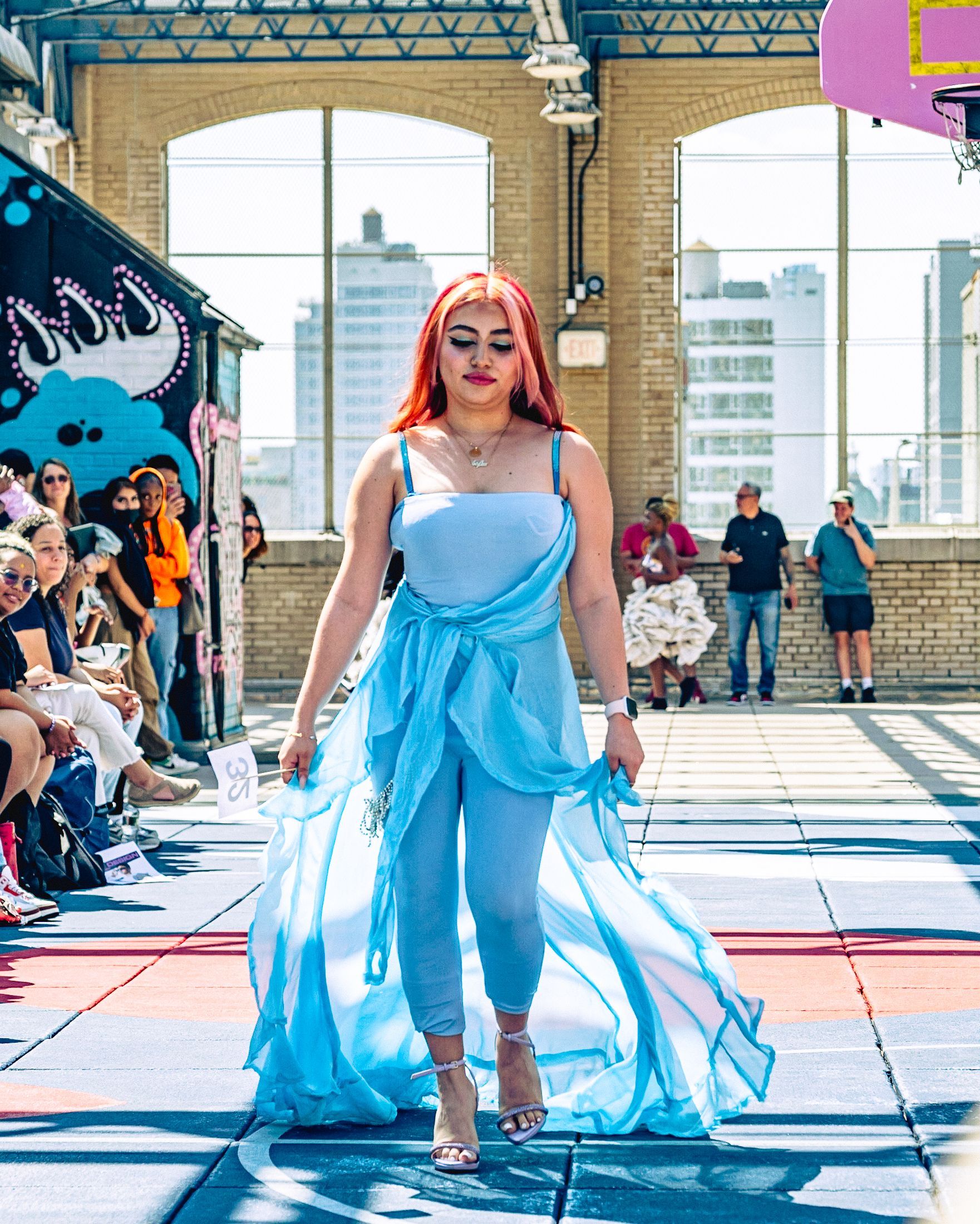 Model in hand-made garment at the 2023 Sustainable Fashion Show at New Design High School. Photo by Luis Suarez