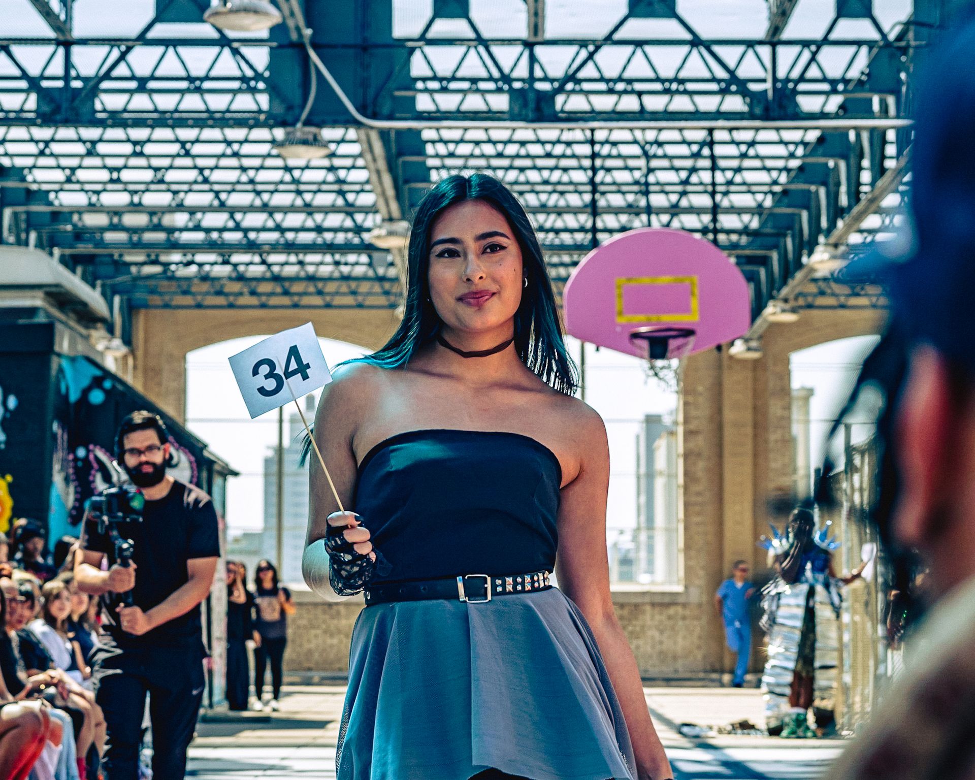 Model in hand-made garment at the 2023 Sustainable Fashion Show at New Design High School. Photo by Luis Suarez