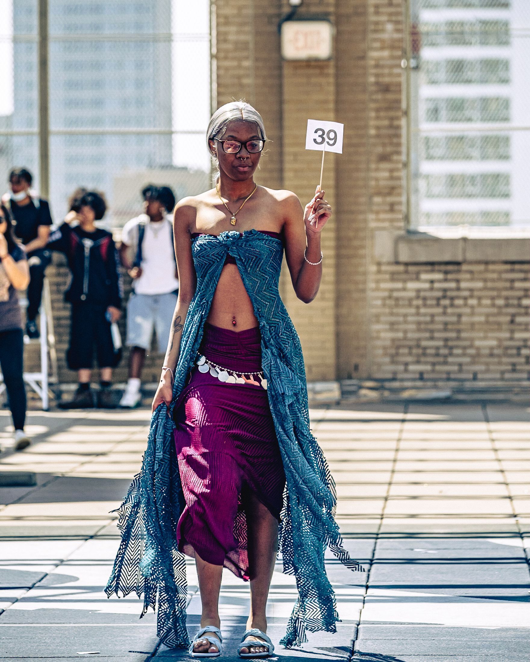Model in hand-made garment at the 2023 Sustainable Fashion Show at New Design High School. Photo by Luis Suarez