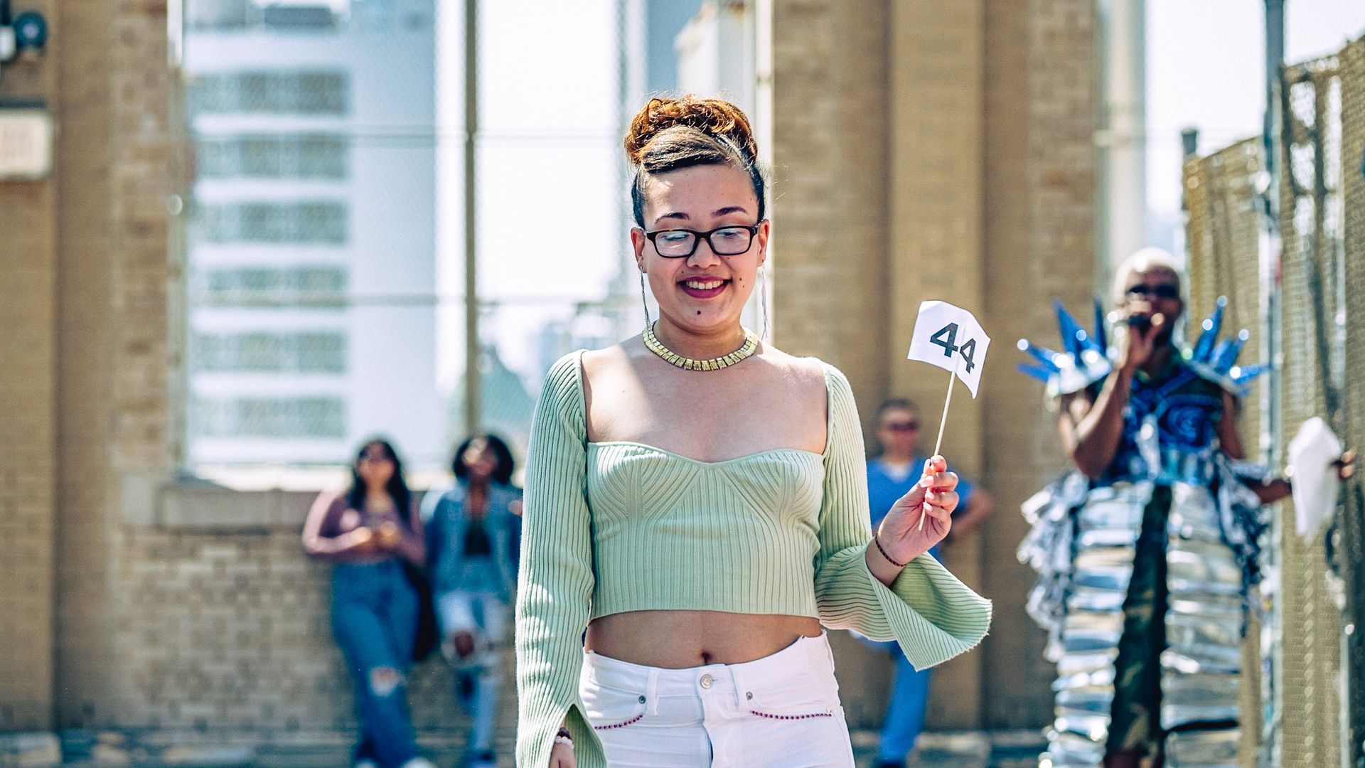 Model in hand-made garment at the 2023 Sustainable Fashion Show at New Design High School. Photo by Luis Suarez
