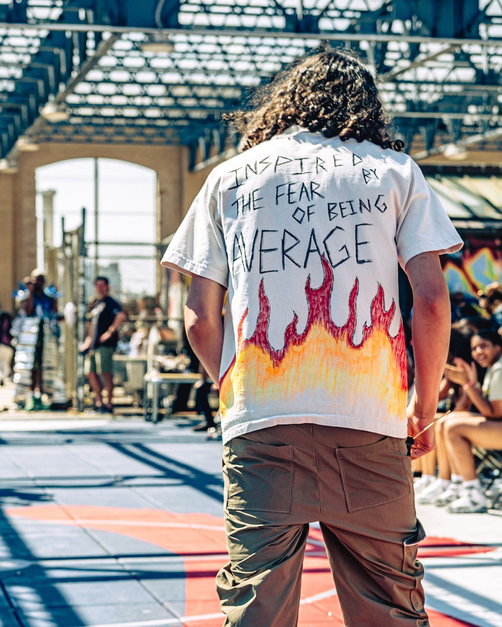 Model in hand-made garment at the 2023 Sustainable Fashion Show at New Design High School. Photo by Luis Suarez