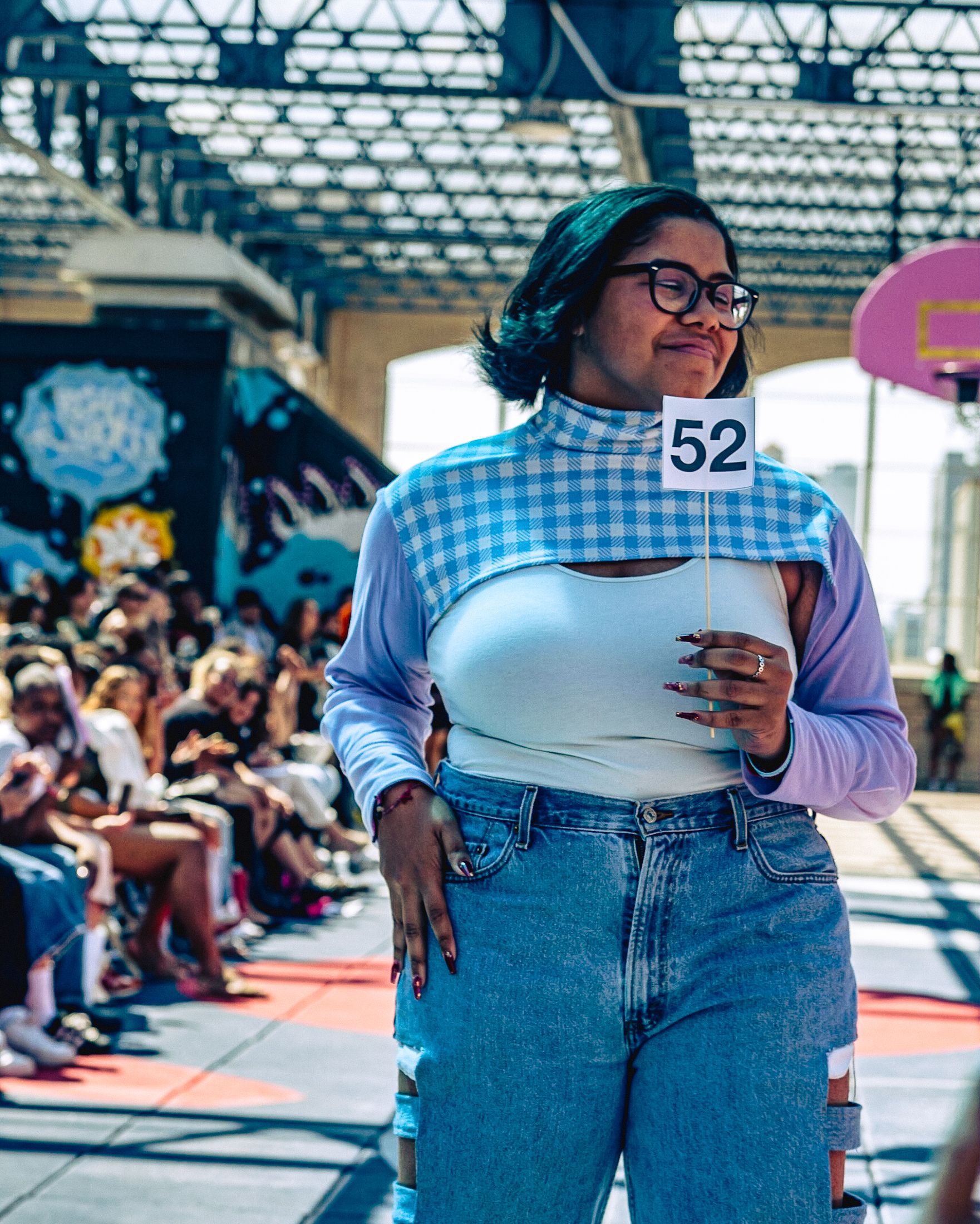 Model in hand-made garment at the 2023 Sustainable Fashion Show at New Design High School. Photo by Luis Suarez