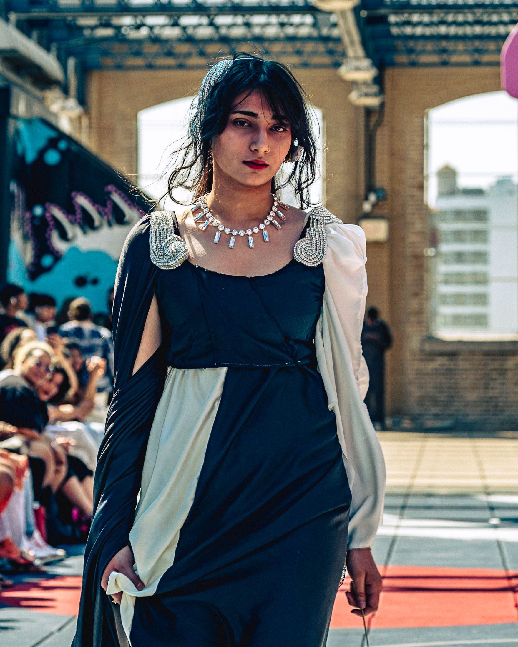 Model in hand-made garment at the 2023 Sustainable Fashion Show at New Design High School. Photo by Luis Suarez