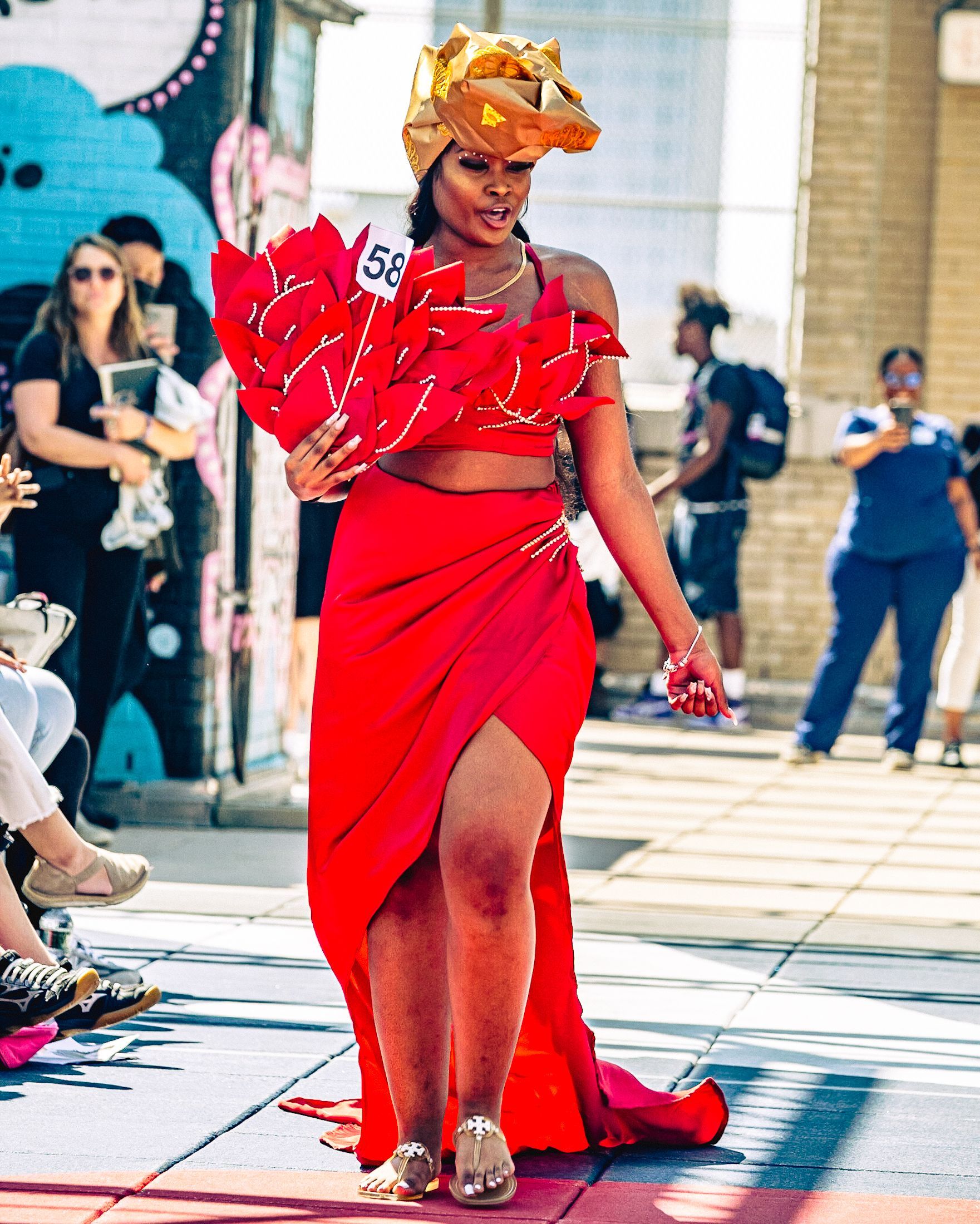 Model in hand-made garment at the 2023 Sustainable Fashion Show at New Design High School. Photo by Luis Suarez