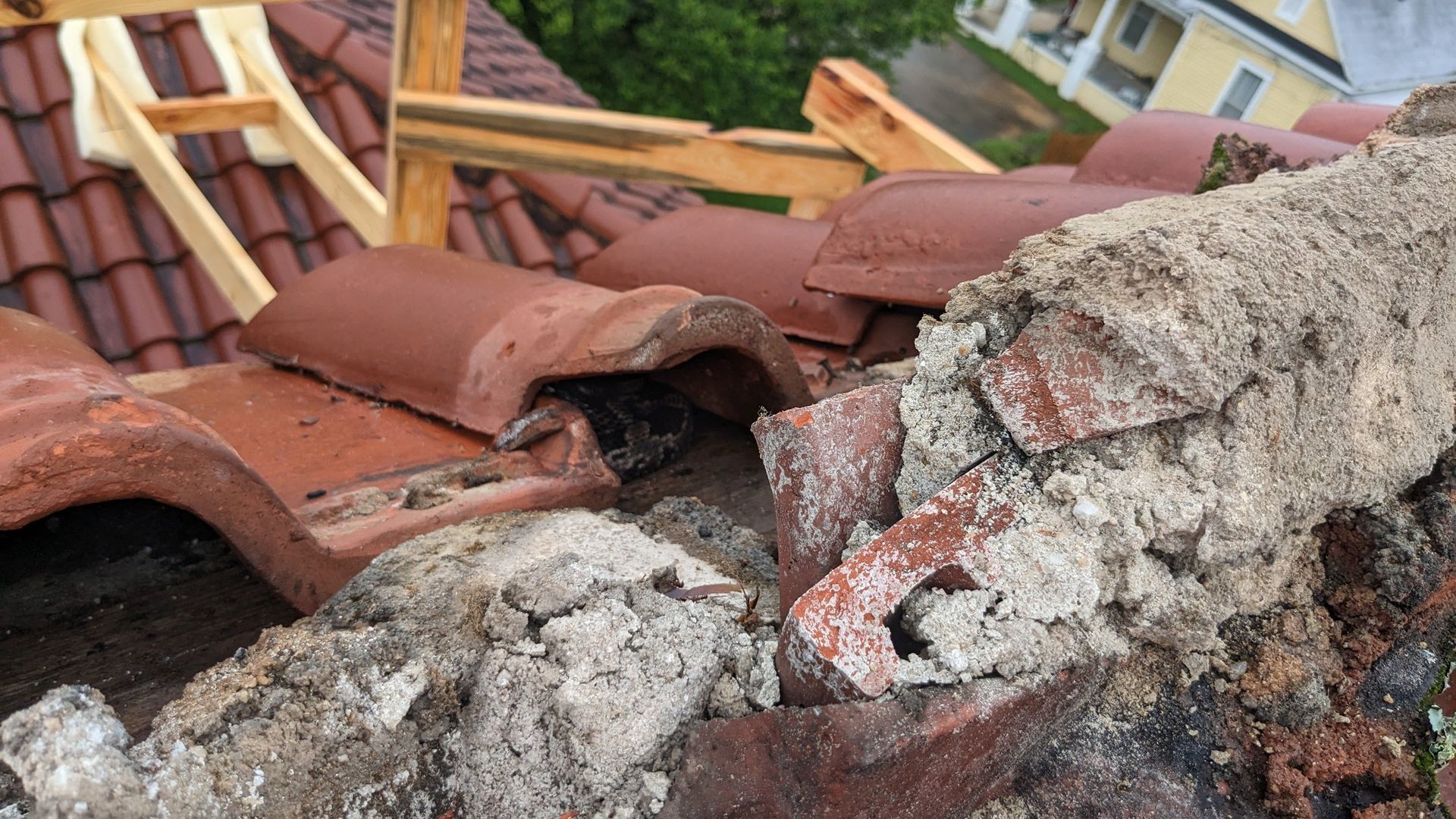 A roof with a lot of bricks and concrete on it