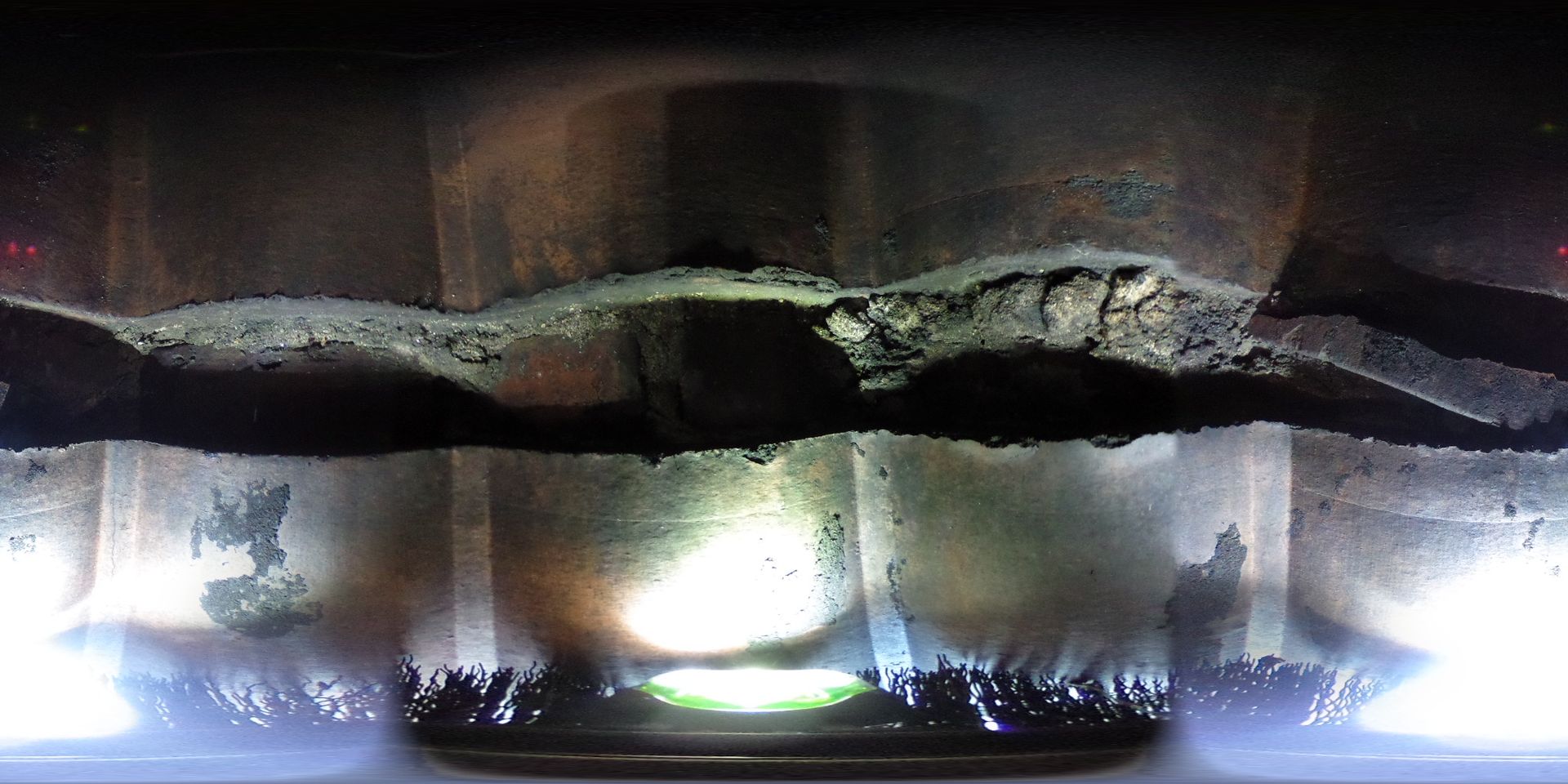 A close up of a piece of metal with a light shining on it.