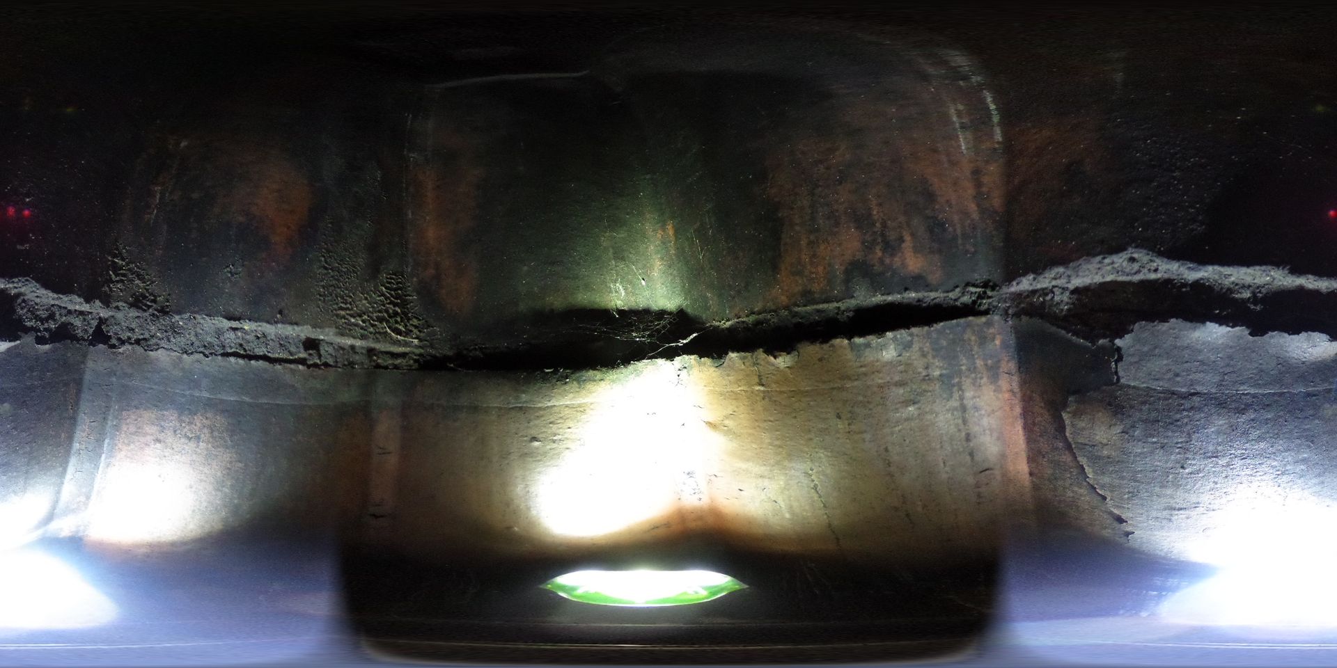 A close up of a glass with a light coming out of it.