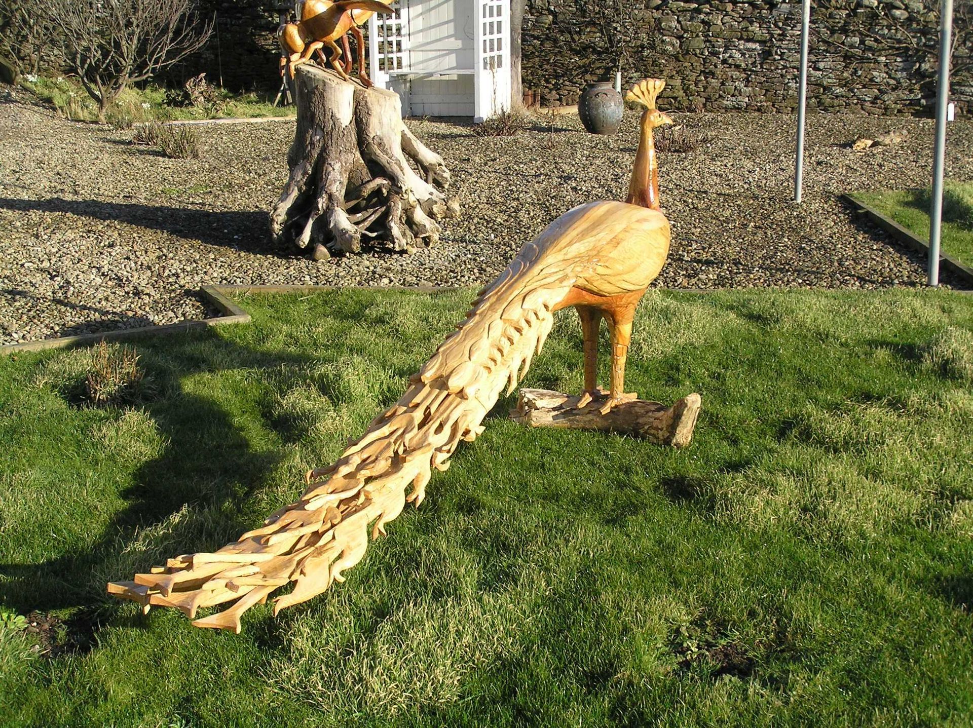 An Indian white peacock garden sculpture made by Ingrained Culture