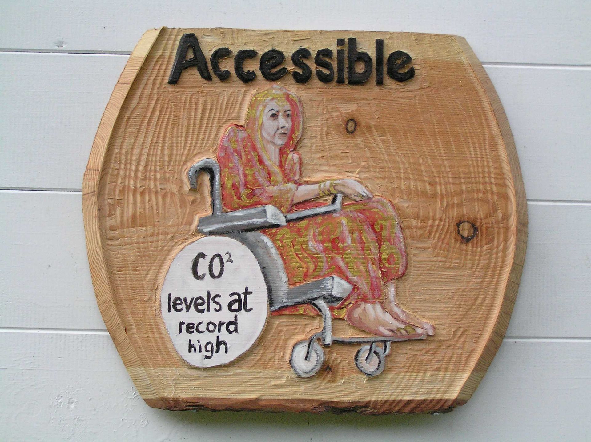 Wooden Eco-friendly accessible toilet sign by Ingrained Culture