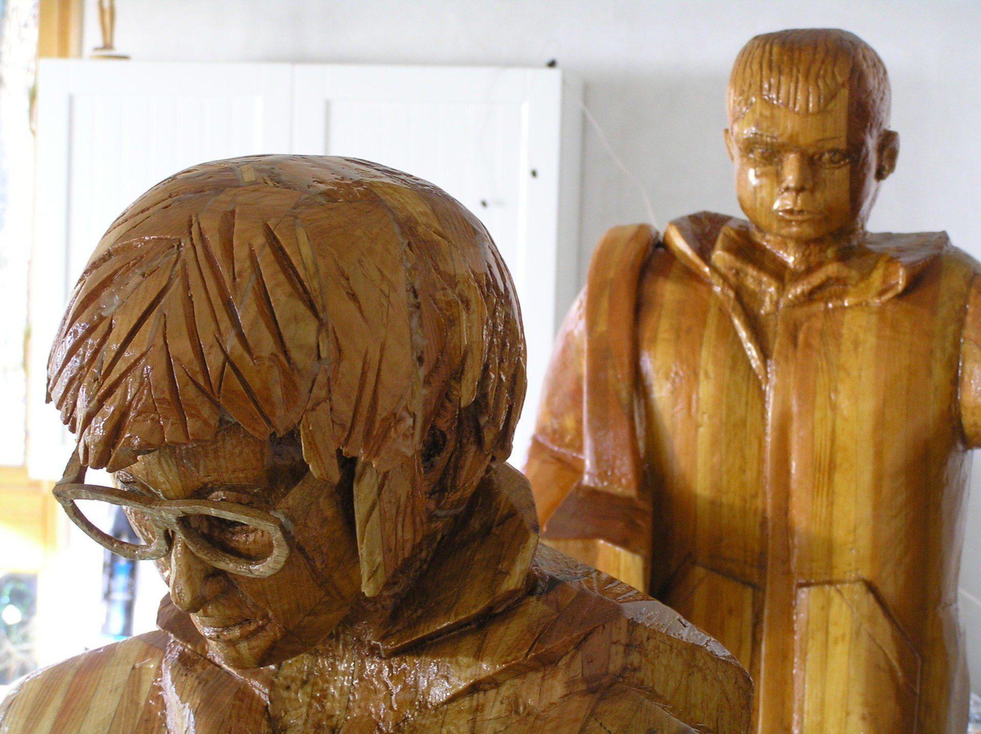 Contemporary wooden British figurative sculpture made by Ingrained Culture