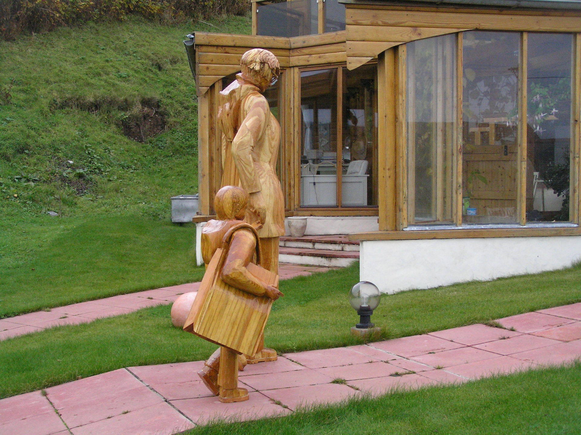 A contemporary wooden garden statue made by Ingrained Culture