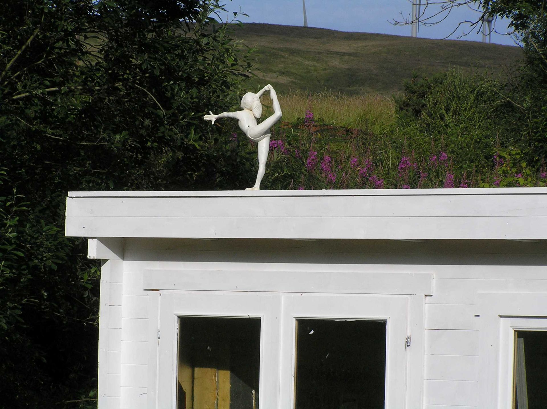 Wooden sustainable Eco-friendly architectural sculpture of a gymnast. made by Ingrained Culture