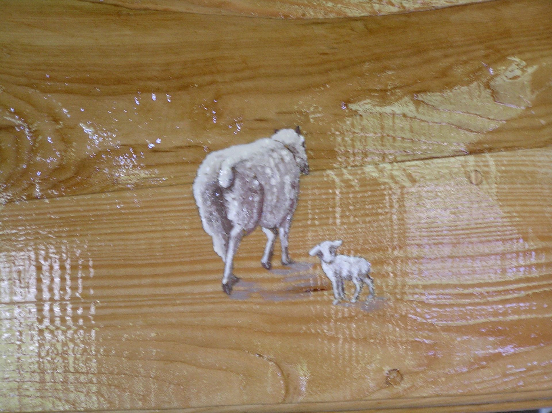 Hand painted  illustration of a ewe and lamb on a wooden house sign by Ingrained Culture