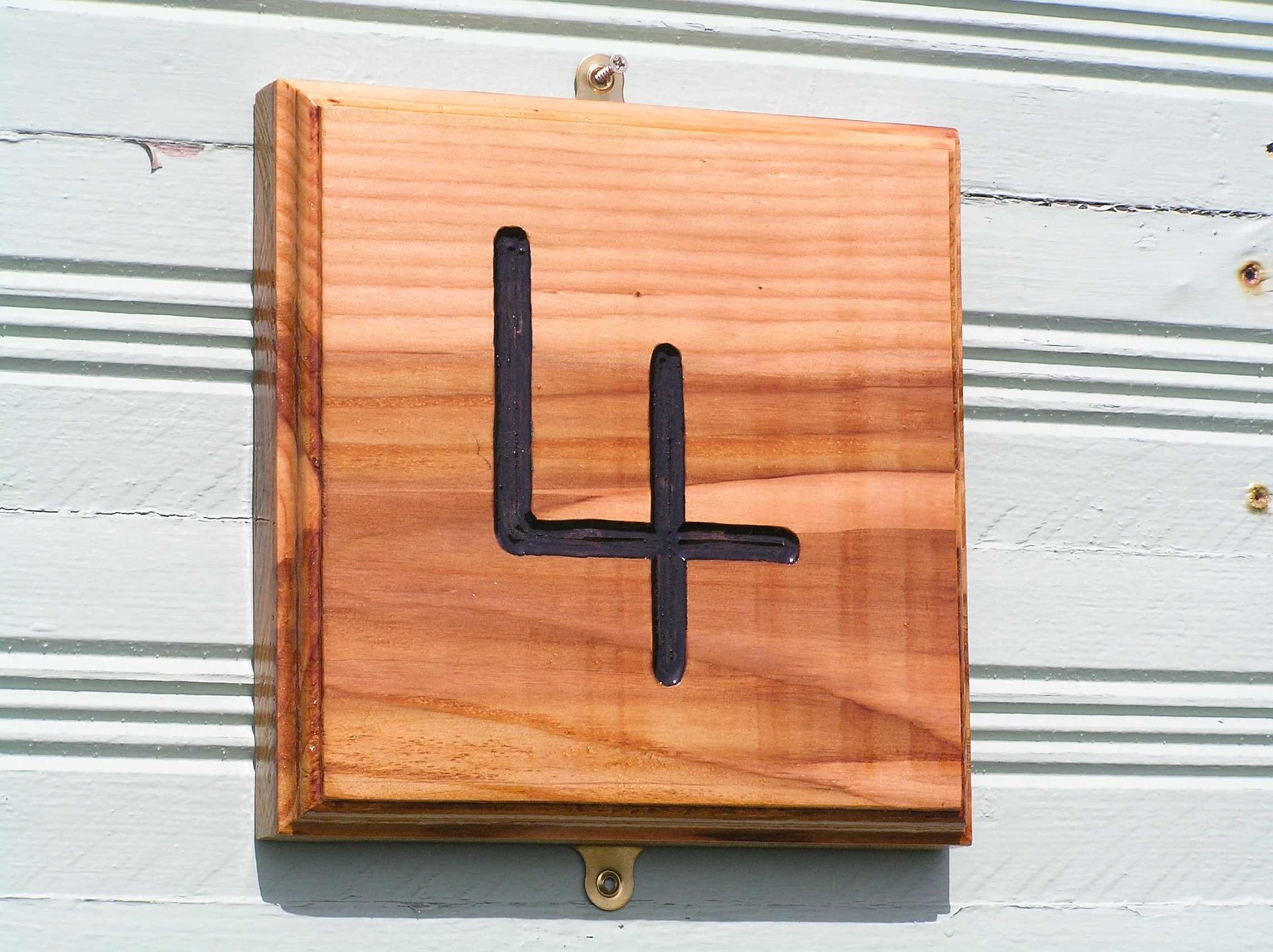 A premium wooden sustainable house number sign by ingrained culture