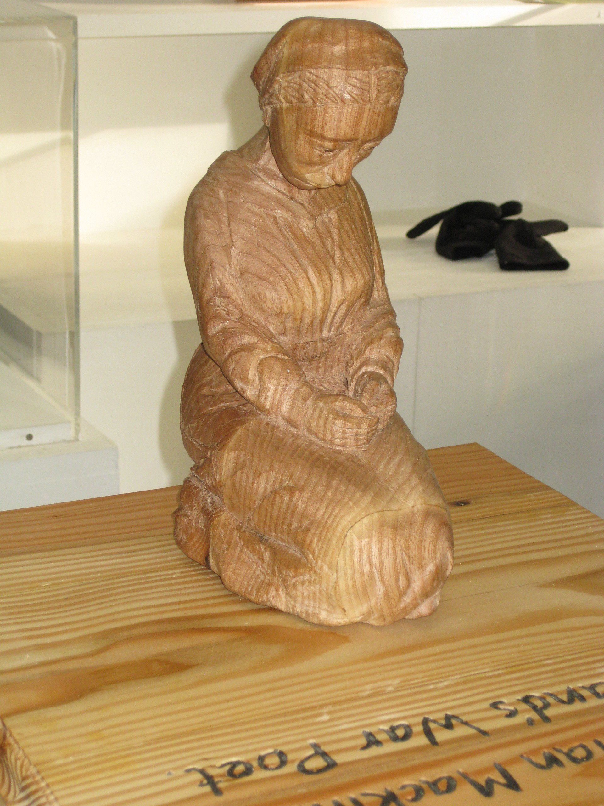 A sculpture of a woman in 1914 dress, made by Ingrained Culture