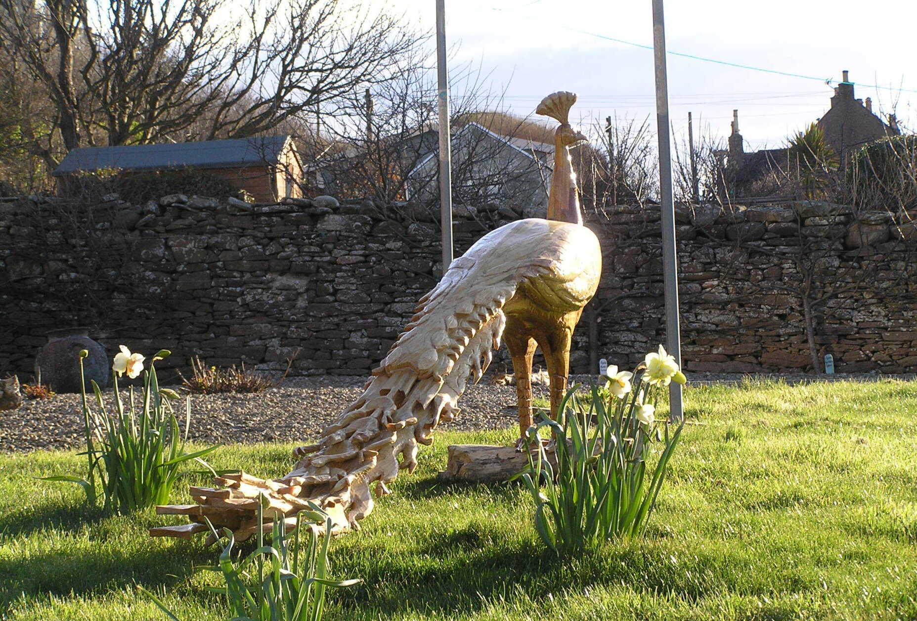 An Indian white peacock garden sculpture made by Ingrained Culture