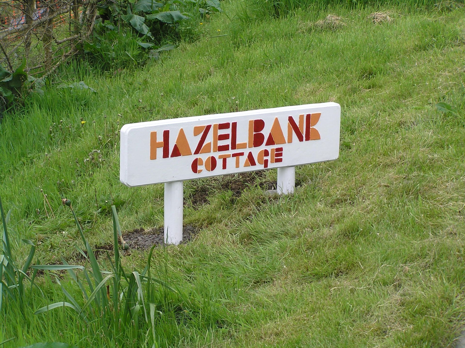 A modernist painted house name sign made by Ingrained Culture