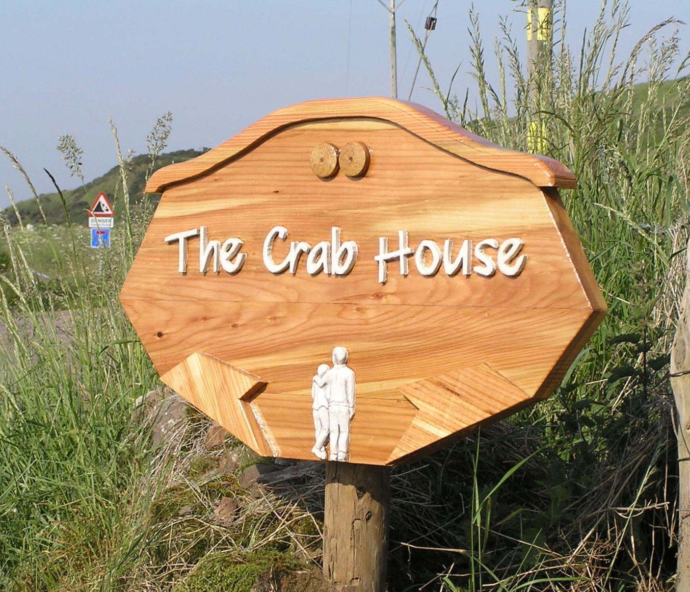 Highly personalised wooden house sign by Ingrained Culture.