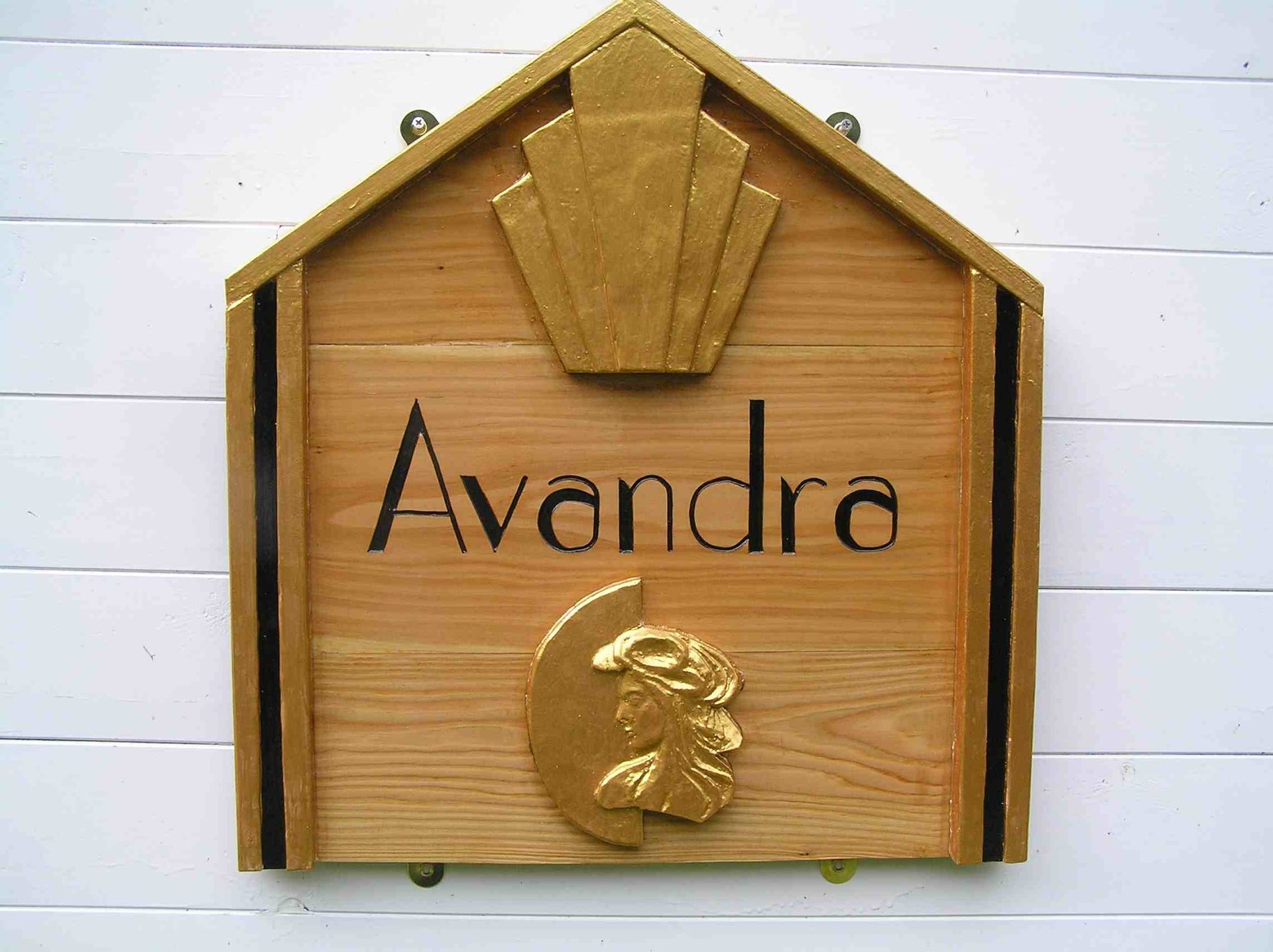 A personalised wooden house sign for Avandra in the Art Deco style made by Robert Ingrained Culture