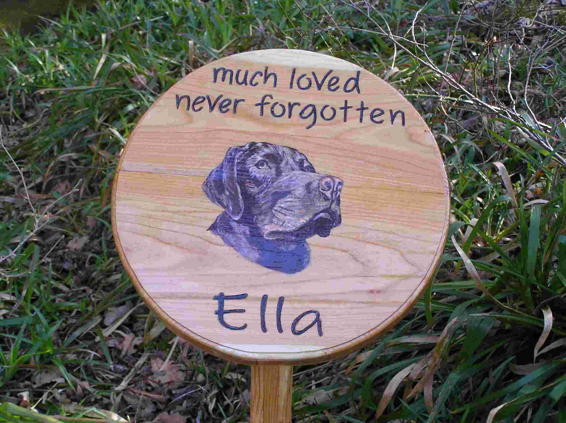 A wooden pet memorial with a hand painted pet portrait of a dog, made by Robert, Ingrained Culture