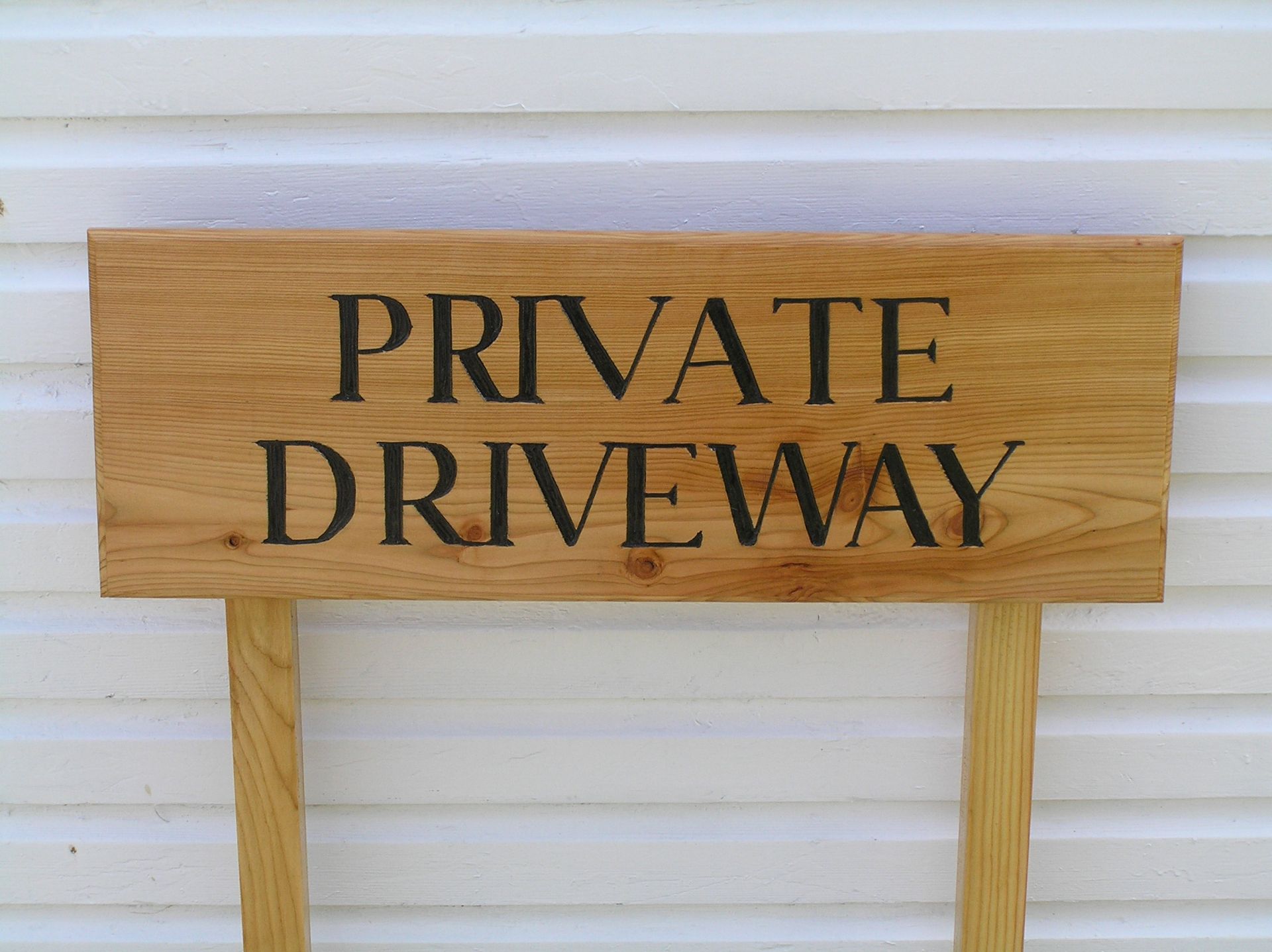 A traditional wooden and Eco-friendly private driveway sign by Ingrained Culture