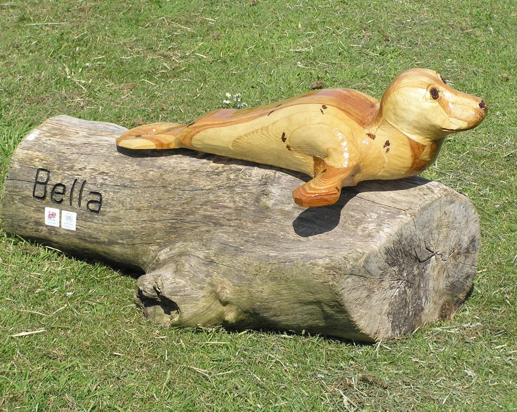 A wooden sculpture of a seal made by Ingrained Culture