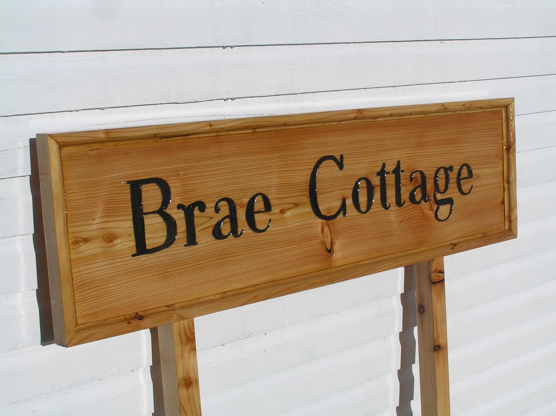 A traditional wooden and Eco-friendly house name sign by Ingrained Culture