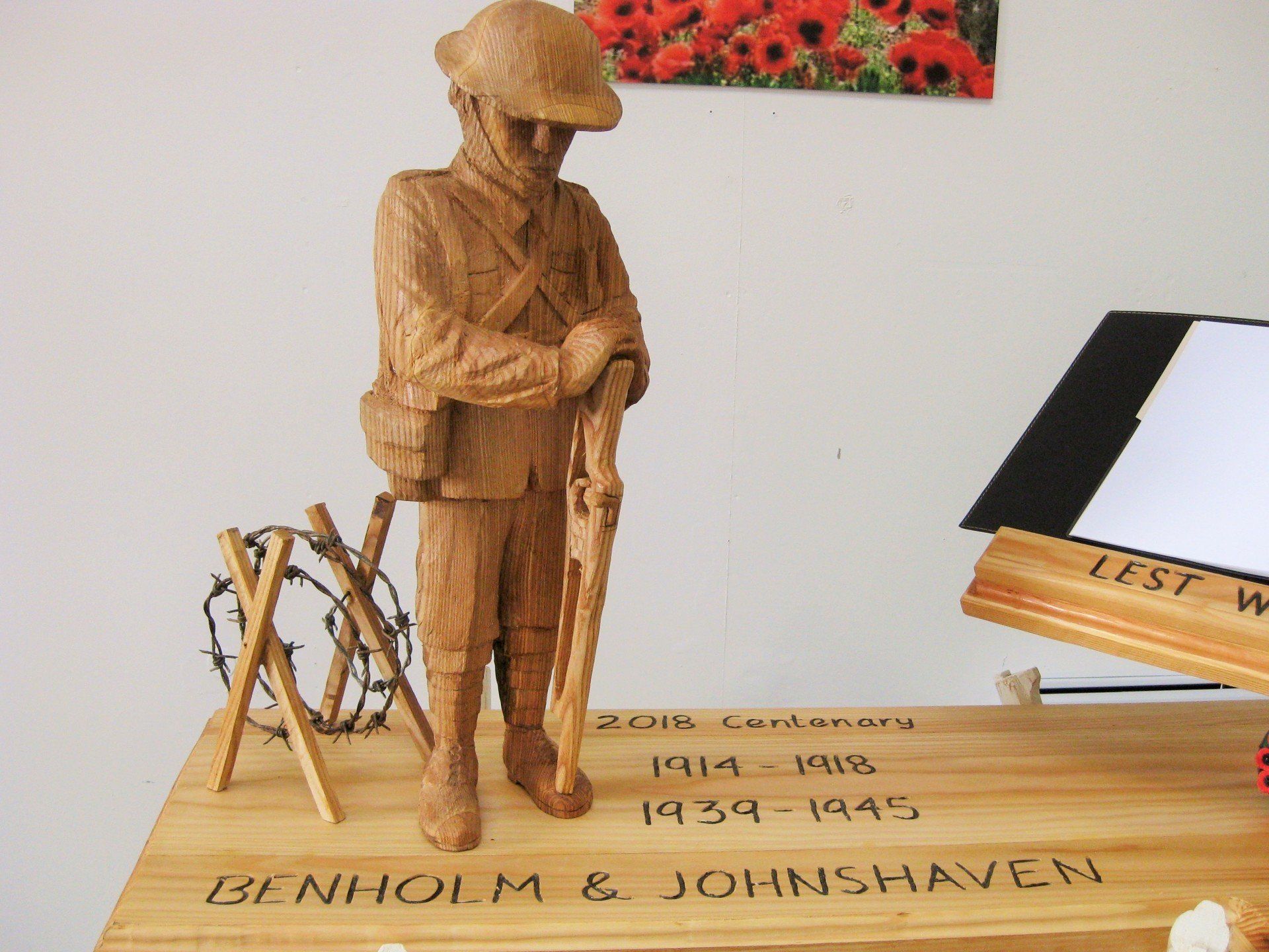 A sculpture of a soldier standing by barbed wire, made by Ingrained Culture