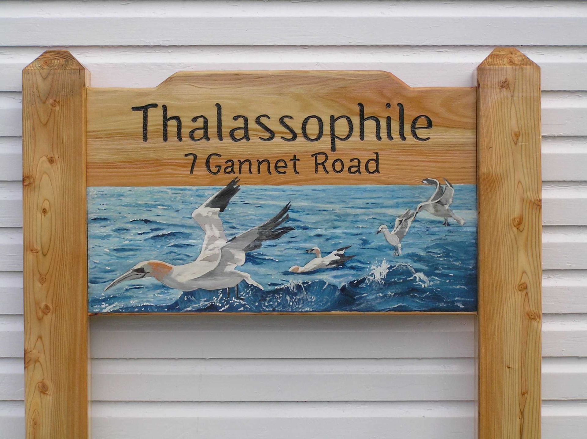 Wooden bespoke house sign with a highly accurate hand painted  marine scene by Ingrained Culture.