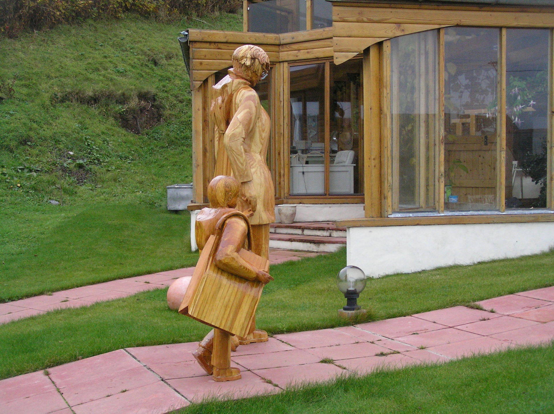 Mother and child wooden sculpture by Ingrained Culture